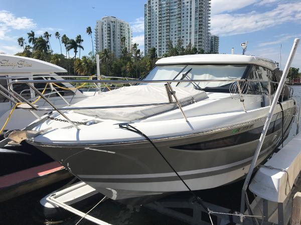 2017 Jeanneau NC 11 yacht docked at marina with cityscape background.