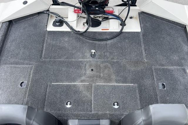 2021 Tracker Pro Team 195 TXW Tournament Edition boat interior with carpeted deck and seating.
