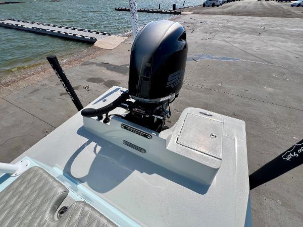 2022 Shallow Sport 20 Classic boat with outboard motor at a dockside.