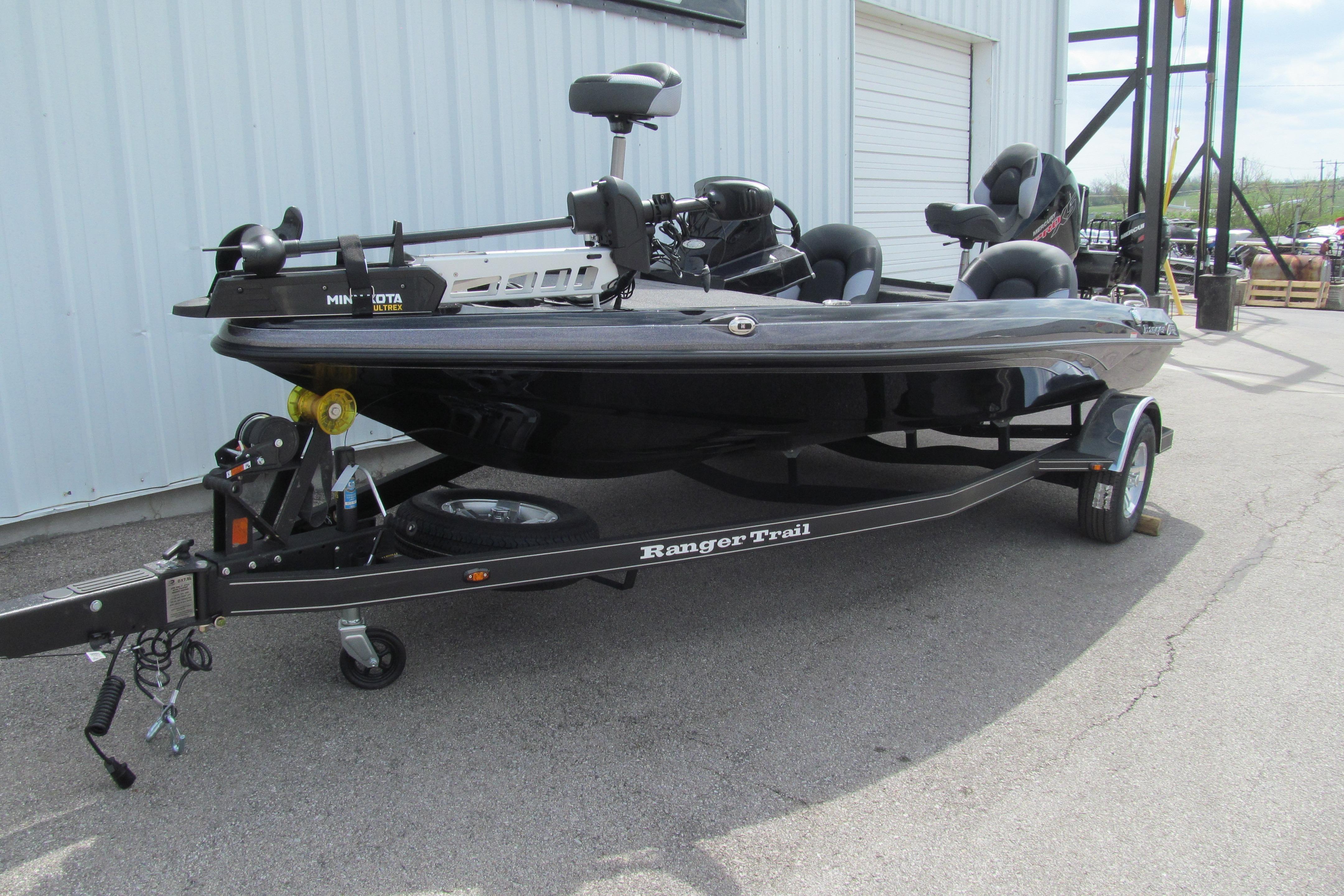 2026 Ranger Z185 fishing boat on trailer, parked outdoors near a building.