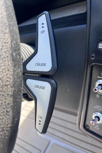 2024 Moomba Max boat controls with cruise adjustment levers.