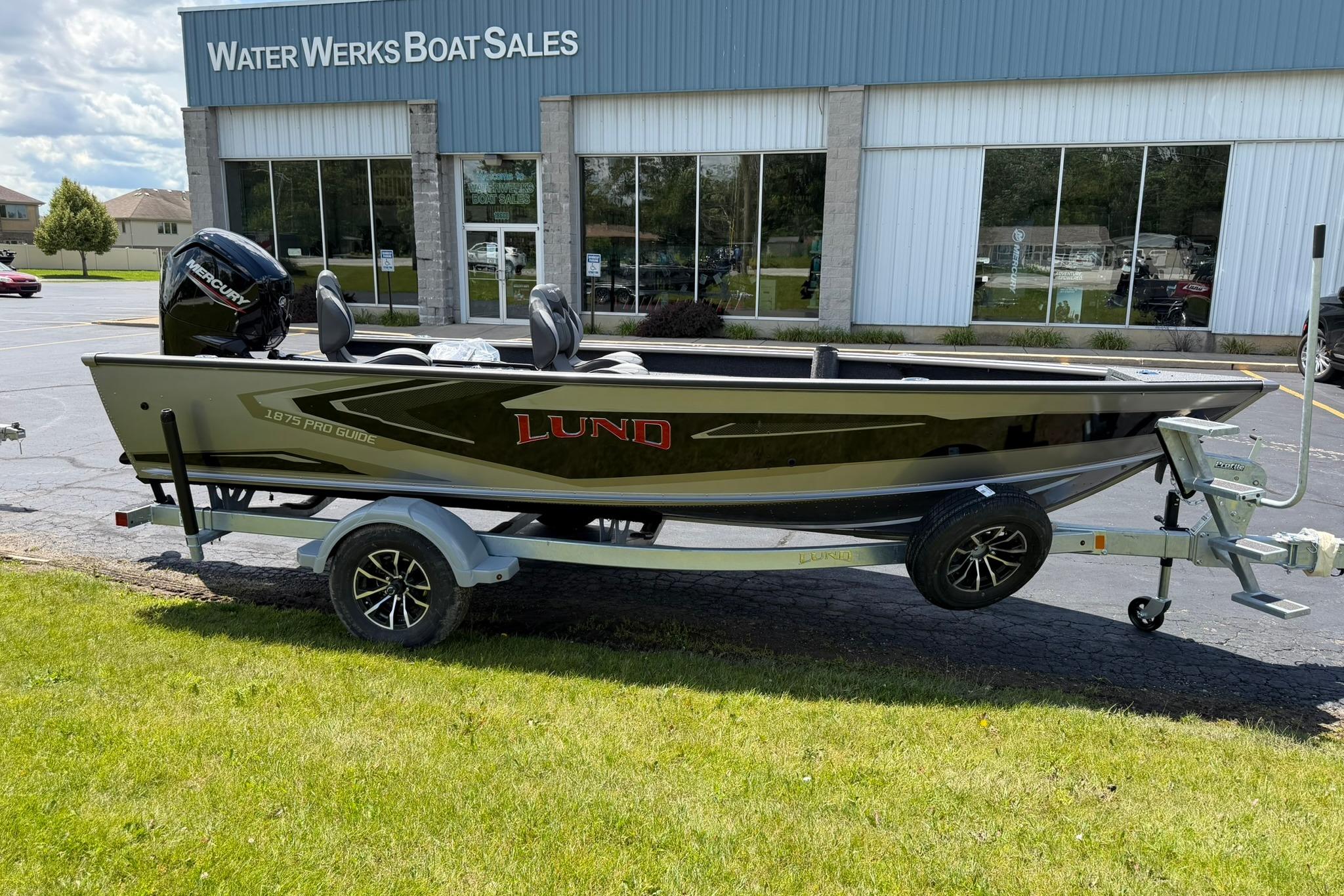 2027 Lund 1875 Pro Guide boat on trailer outside Water Werks Boat Sales.