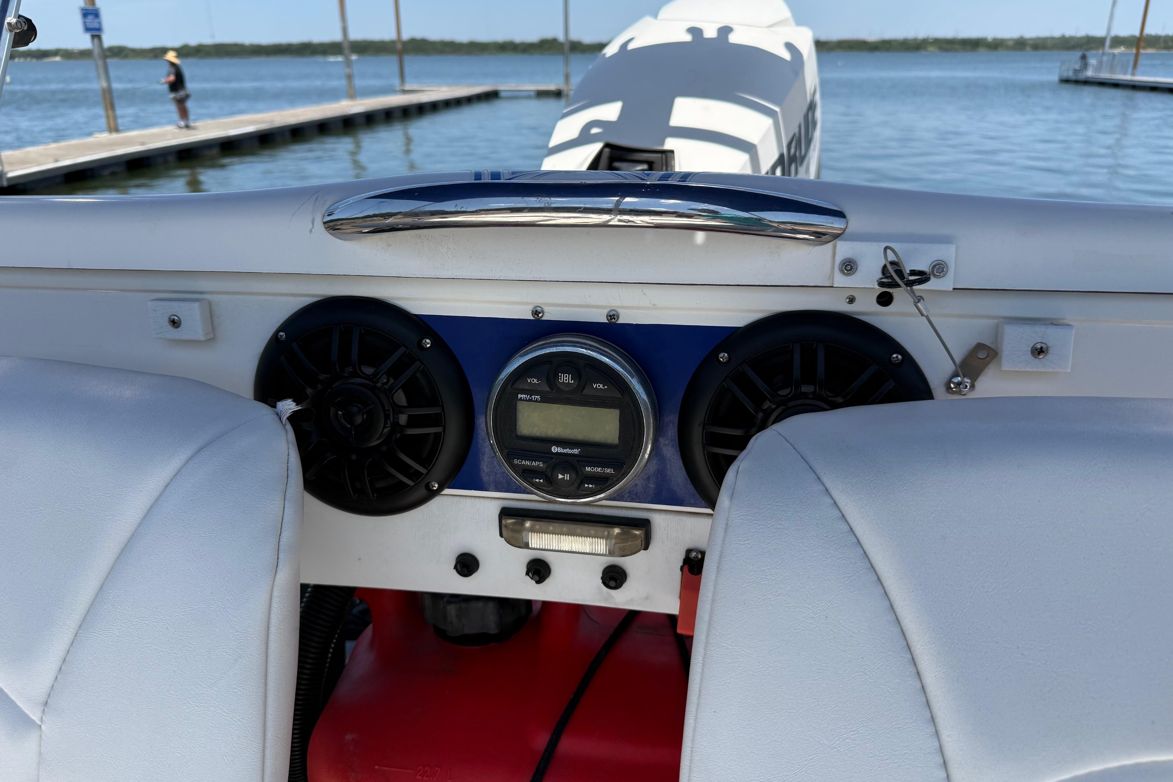 Dashboard of a 2016 CraigCat E2 Elite boat with speakers and controls.