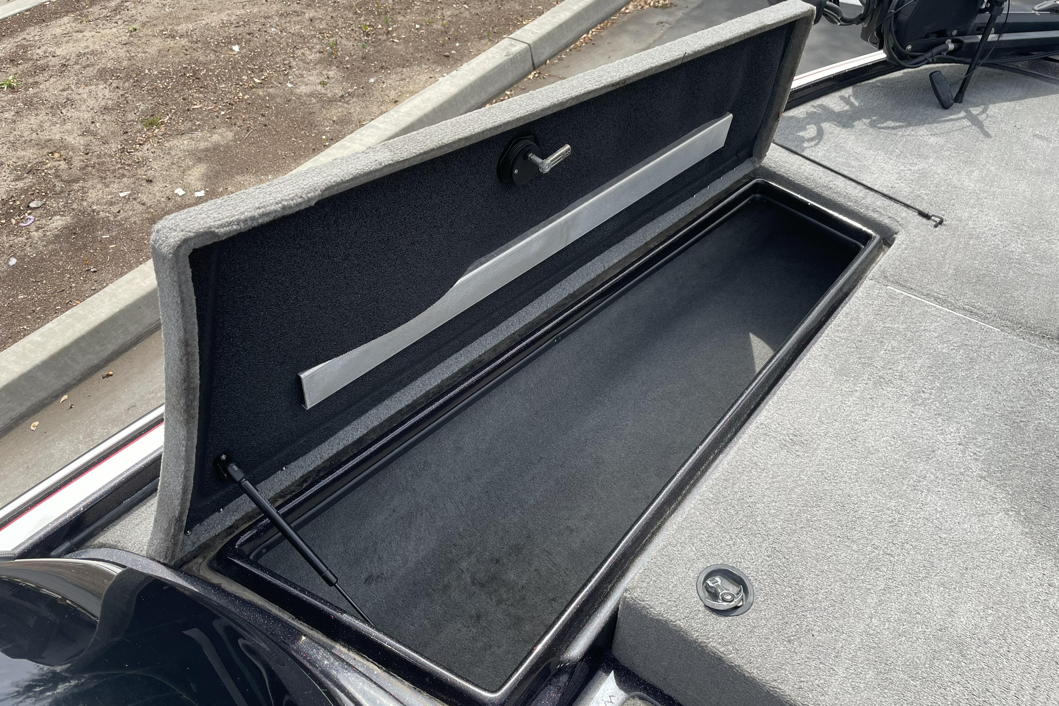 Open storage compartment in a 2013 Nitro Z-8 boat, showcasing interior space.