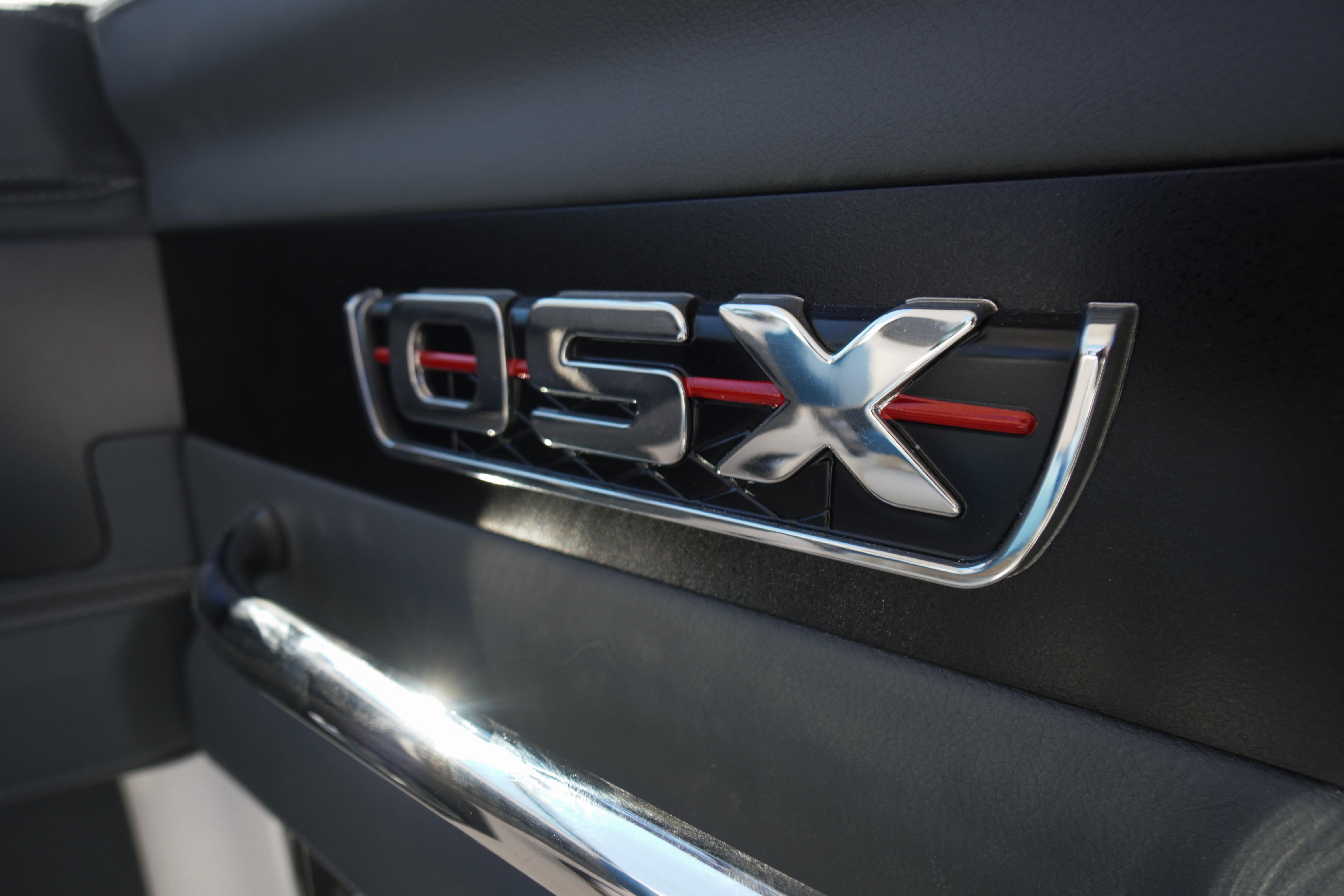 2026 Chaparral 270 OSX emblem on sleek black surface.