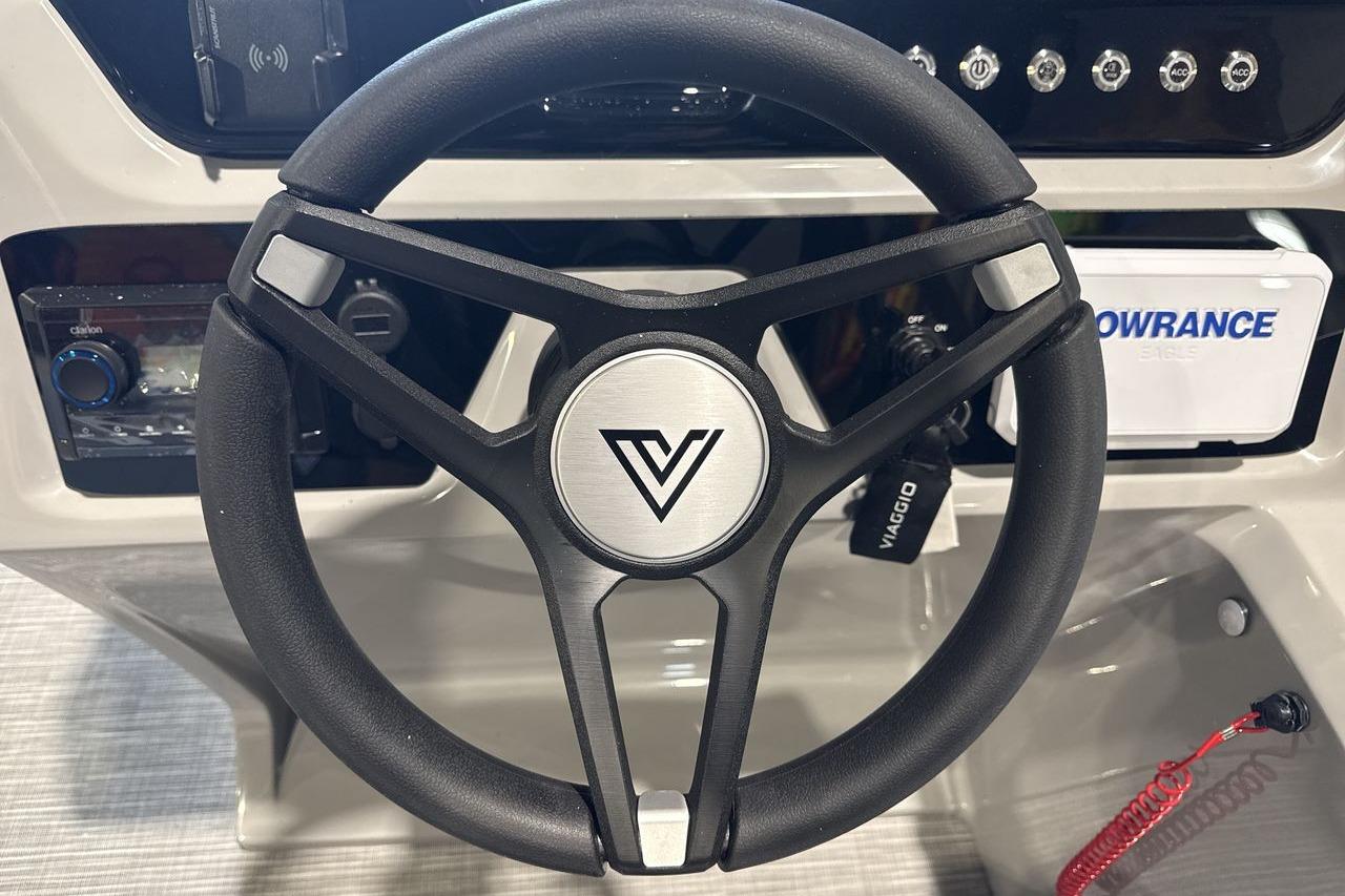 Steering wheel of 2026 Viaggio V20R boat with control panel and navigation system.