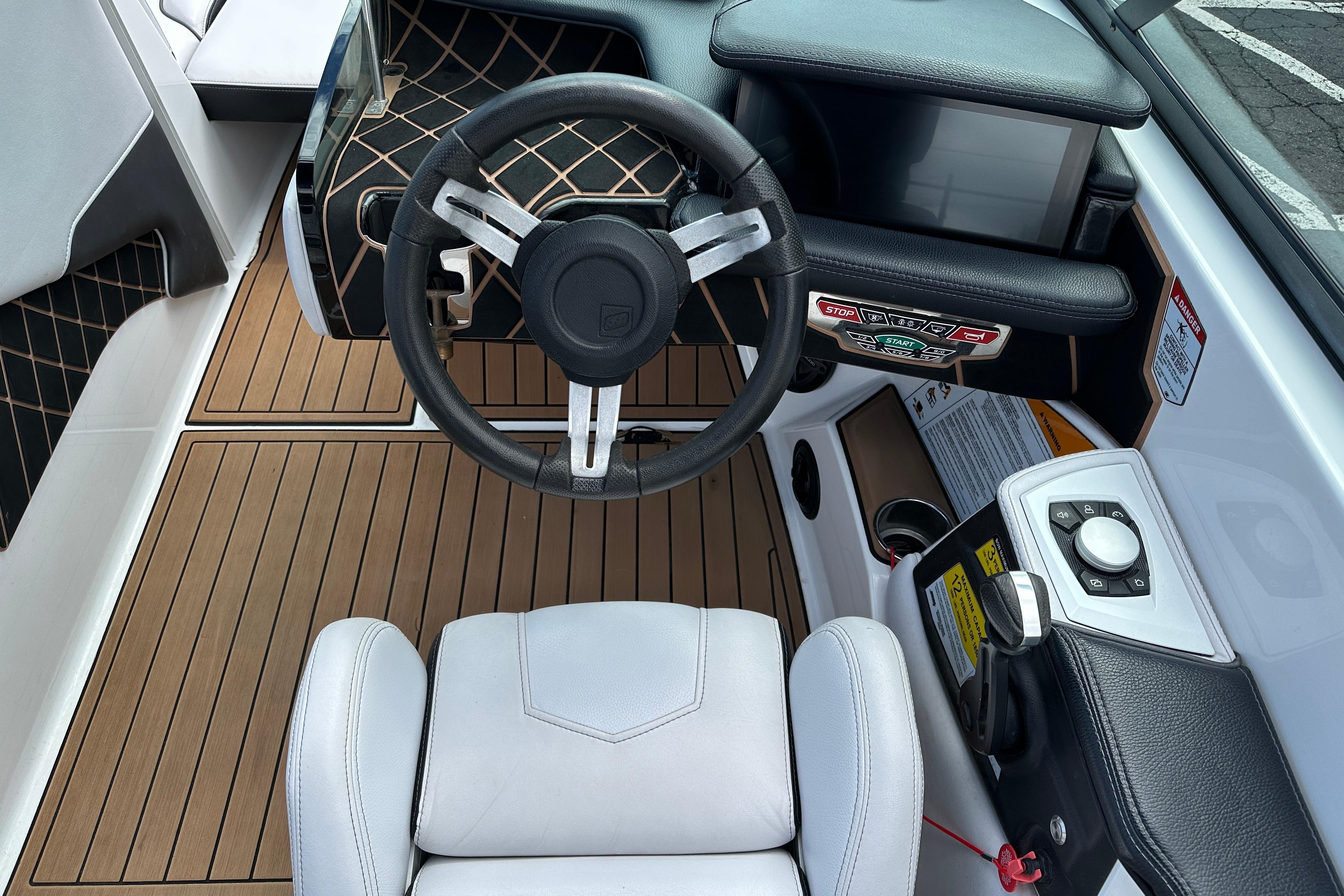 2017 Nautique Super Air Nautique GS20 cockpit with modern steering and control panel.