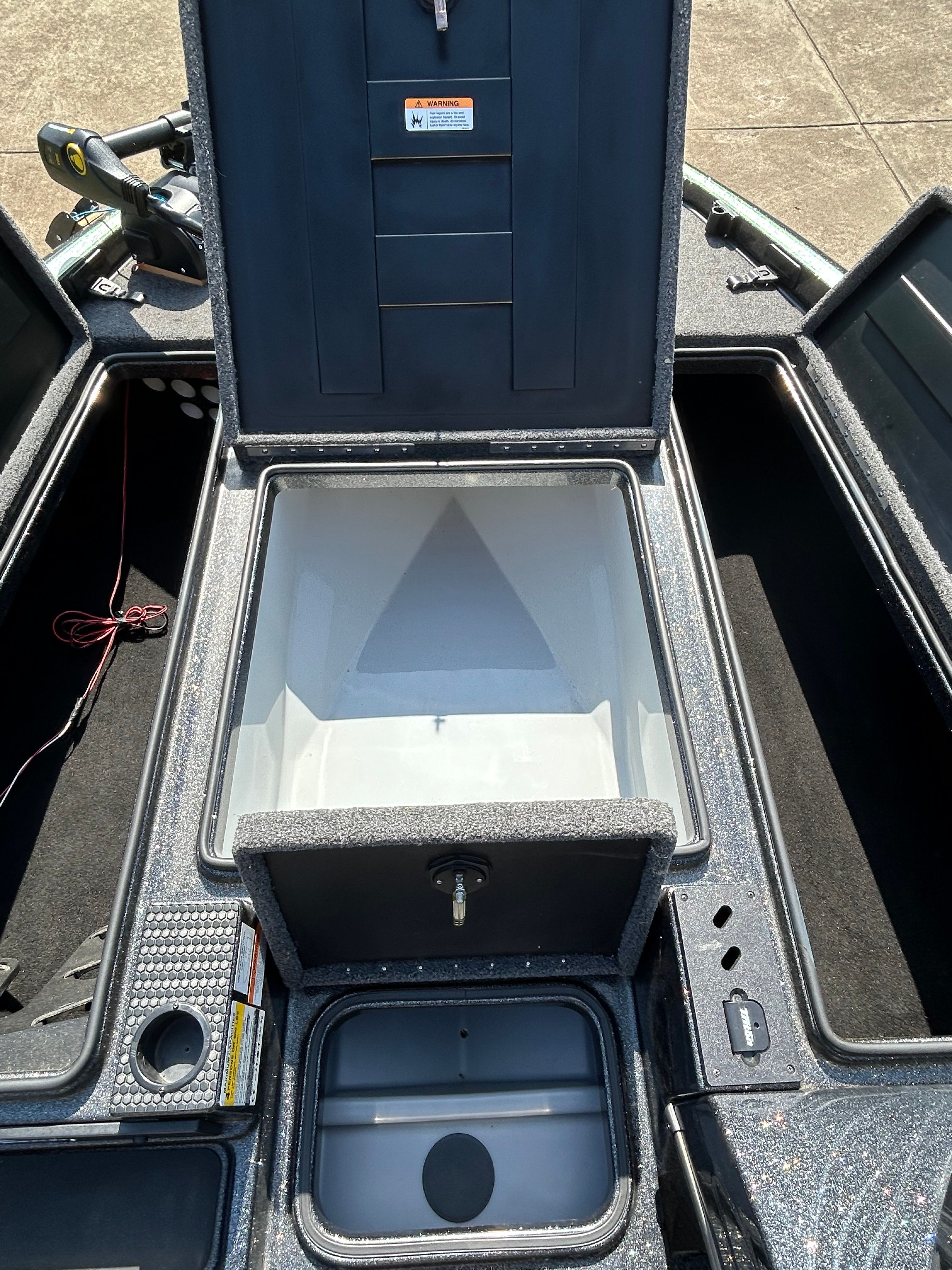 The image shows the storage compartment of a 2020 Trident 189 TRX boat.