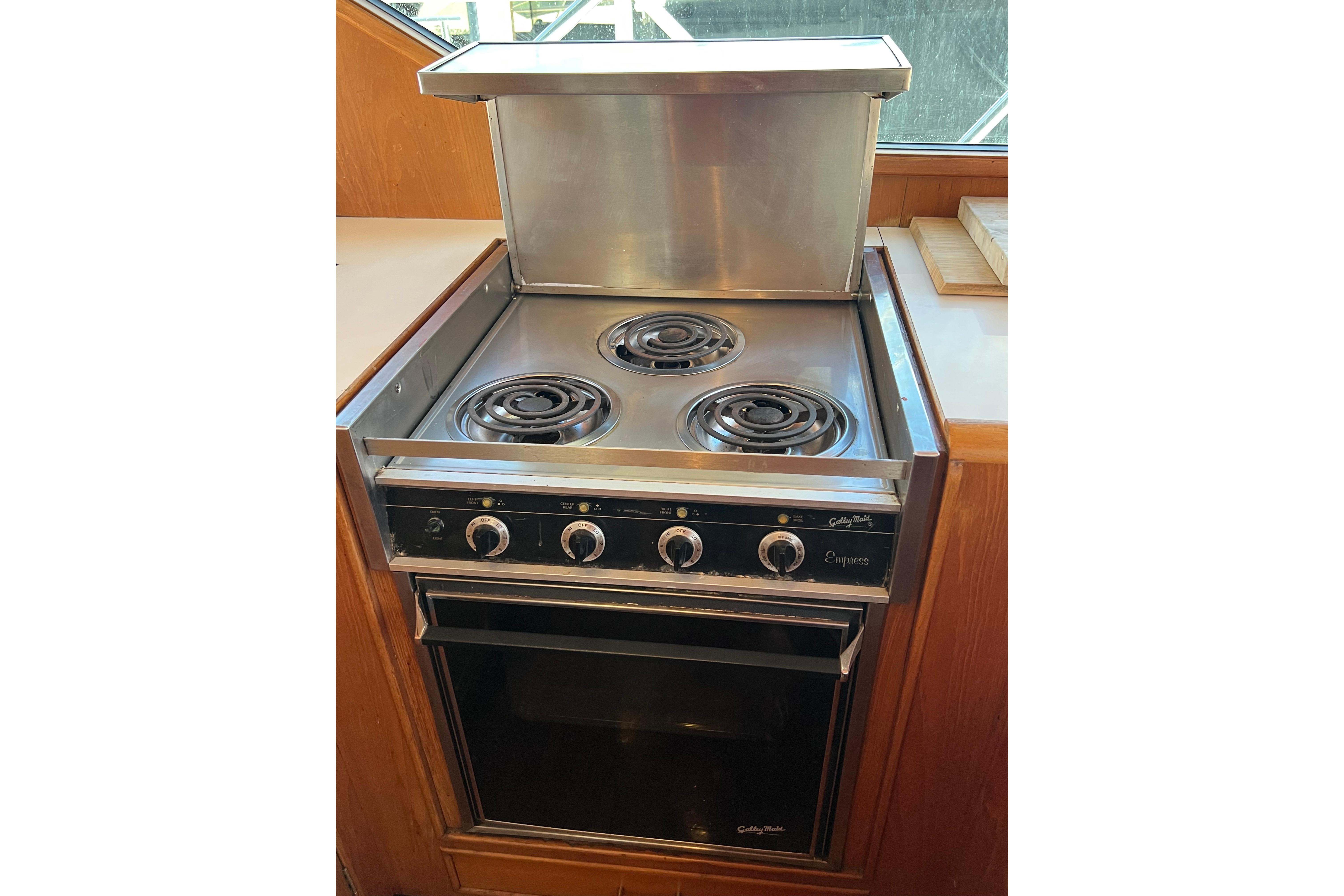 Electric stove and oven in 1990 Ocean Alexander 42 yacht kitchen.