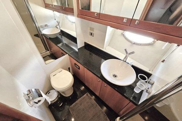 Luxurious bathroom in 2005 Sunseeker Manhattan 66 yacht with modern fixtures and elegant design.