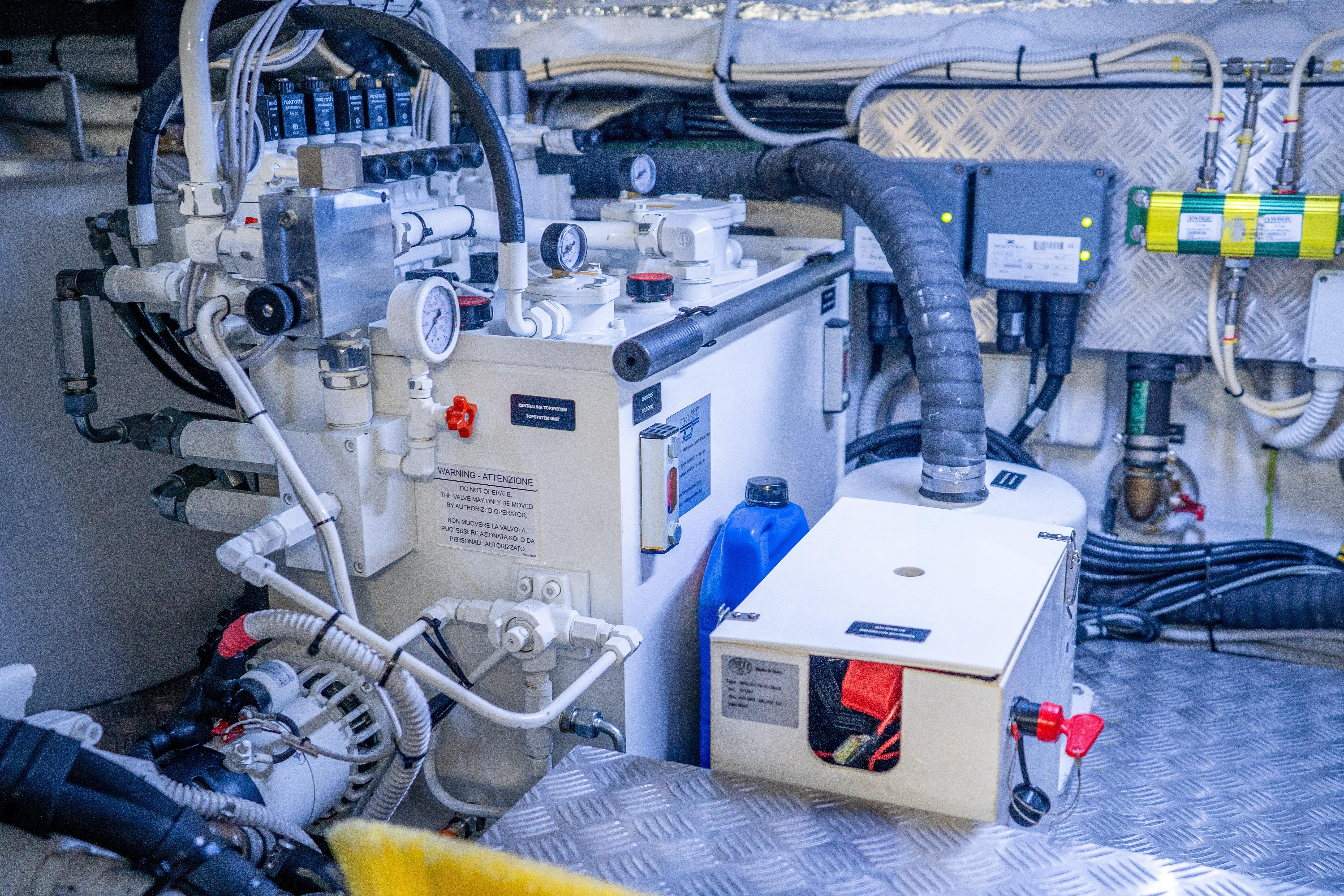 Engine room of 2024 Pershing 7X yacht, showcasing complex machinery and control systems.