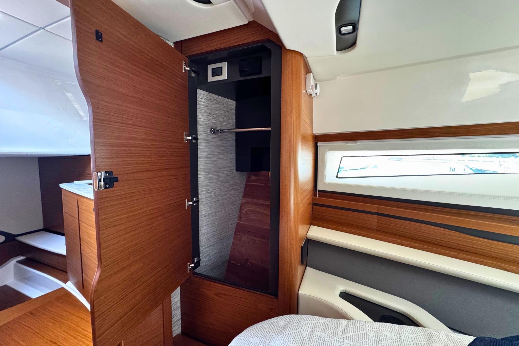 Interior of 2027 Tiara Yachts 39 LE, featuring wood cabinetry and modern design elements.