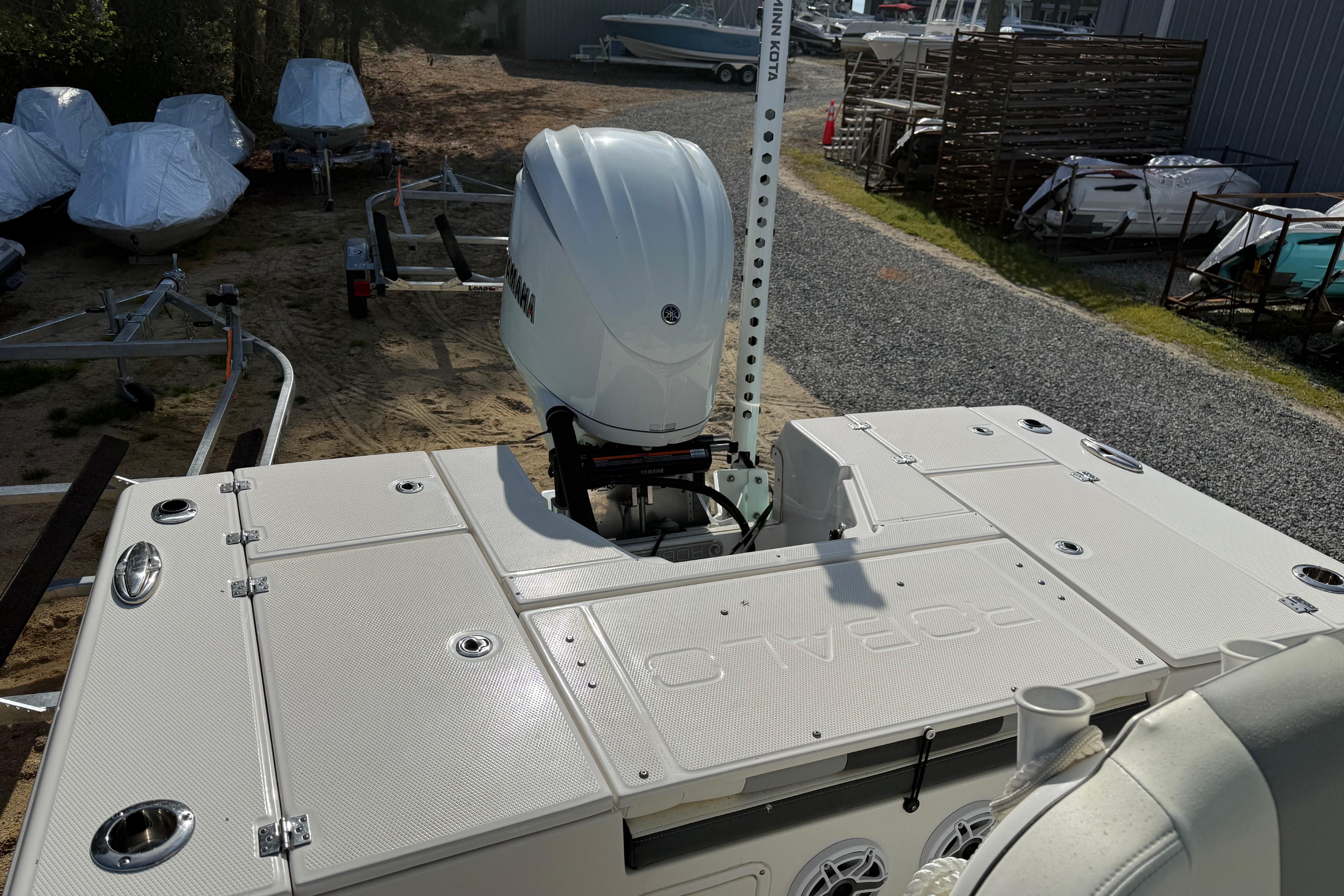 2023 Robalo 246 Cayman boat with Yamaha outboard motor, parked on a trailer.