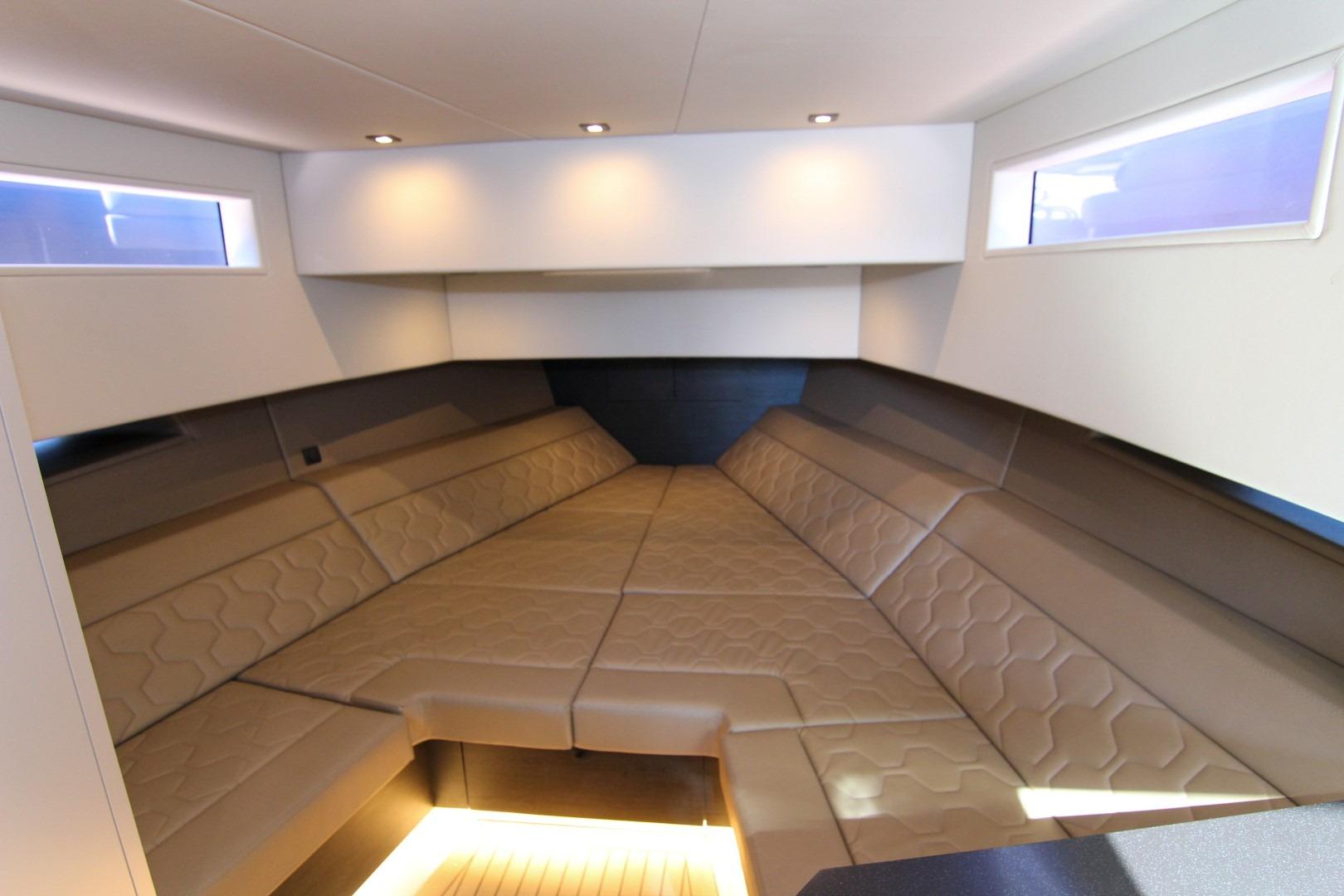 Luxurious interior of 2022 Vanquish Yachts VQ45 with elegant seating and ambient lighting.