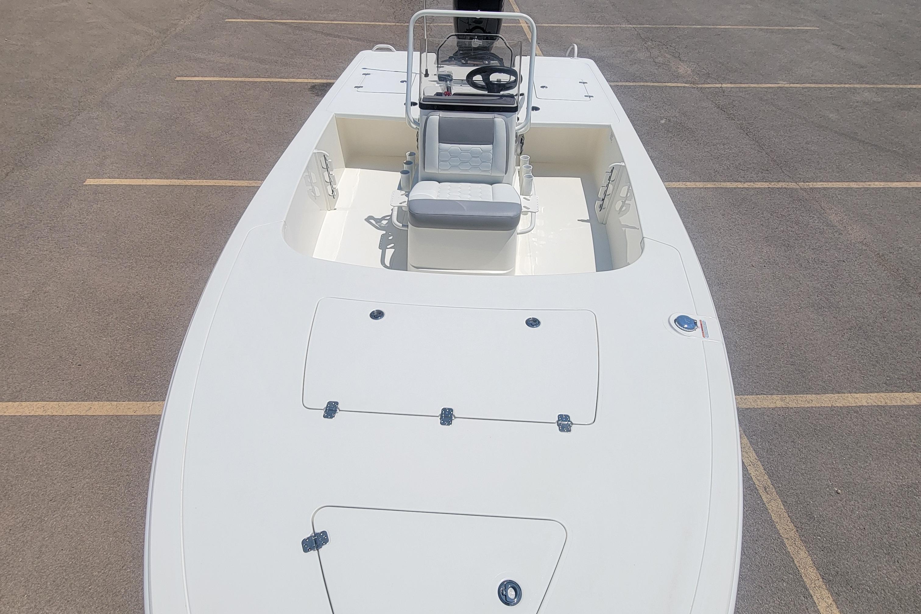 2026 Mako 18 Pro Skiff boat, top view, parked on asphalt.