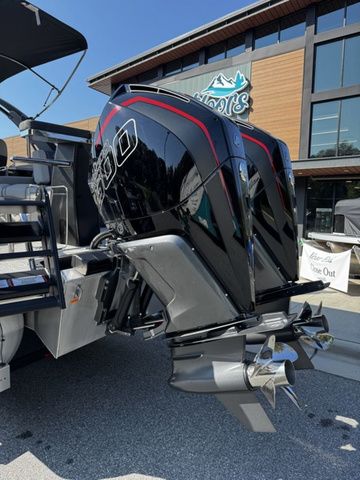 2025 Barletta Lusso L25MAT boat with powerful dual outboard motors, displayed outdoors.