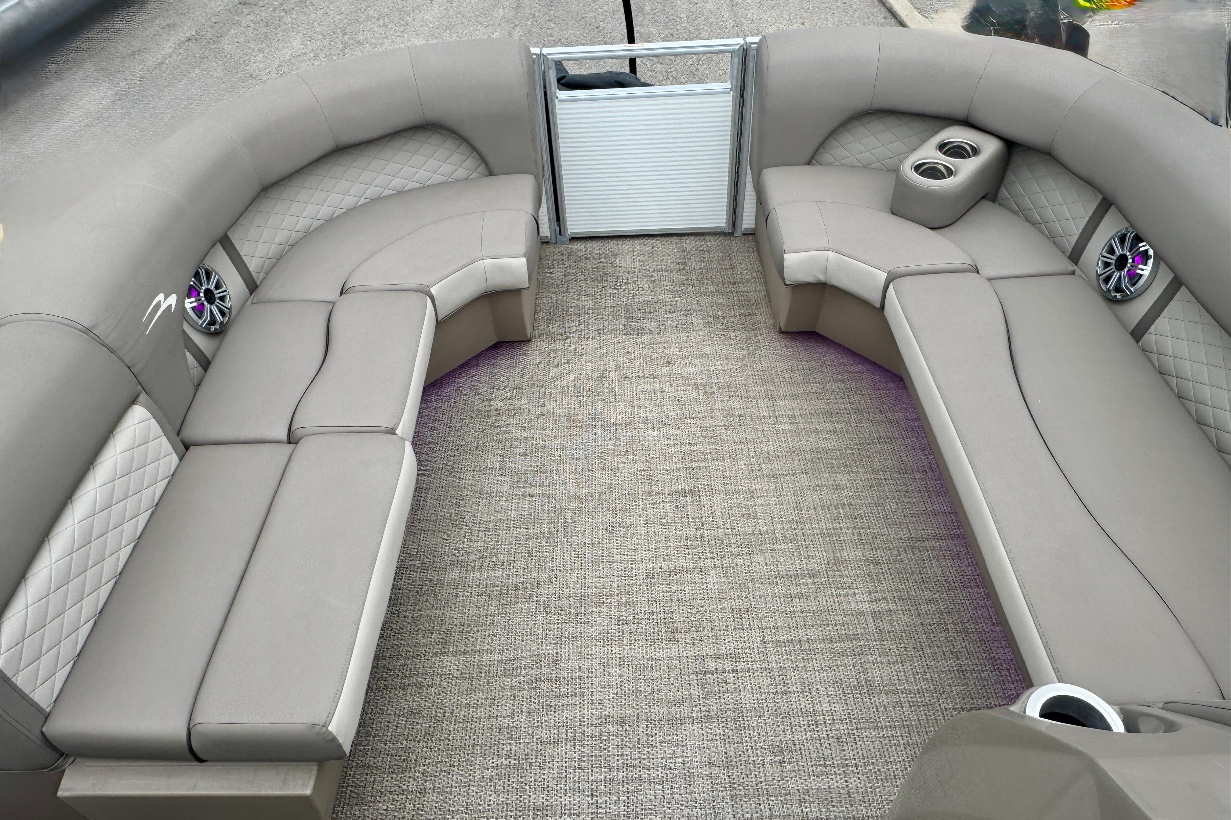 2019 Bennington SX 22 SSBXP pontoon boat interior with plush seating and cup holders.