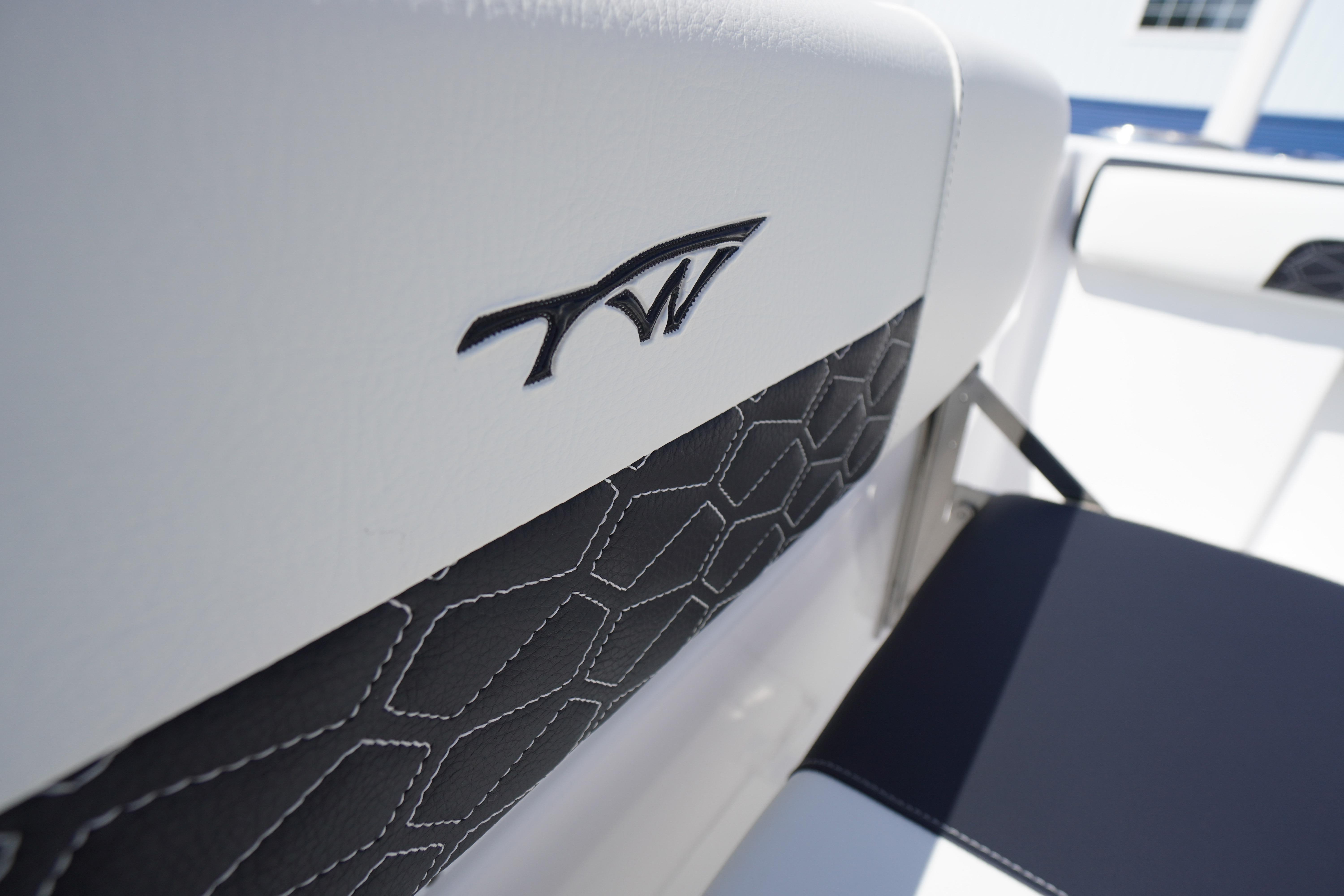 2026 Tidewater 220 CC Adventure boat interior with logo and stylish upholstery.