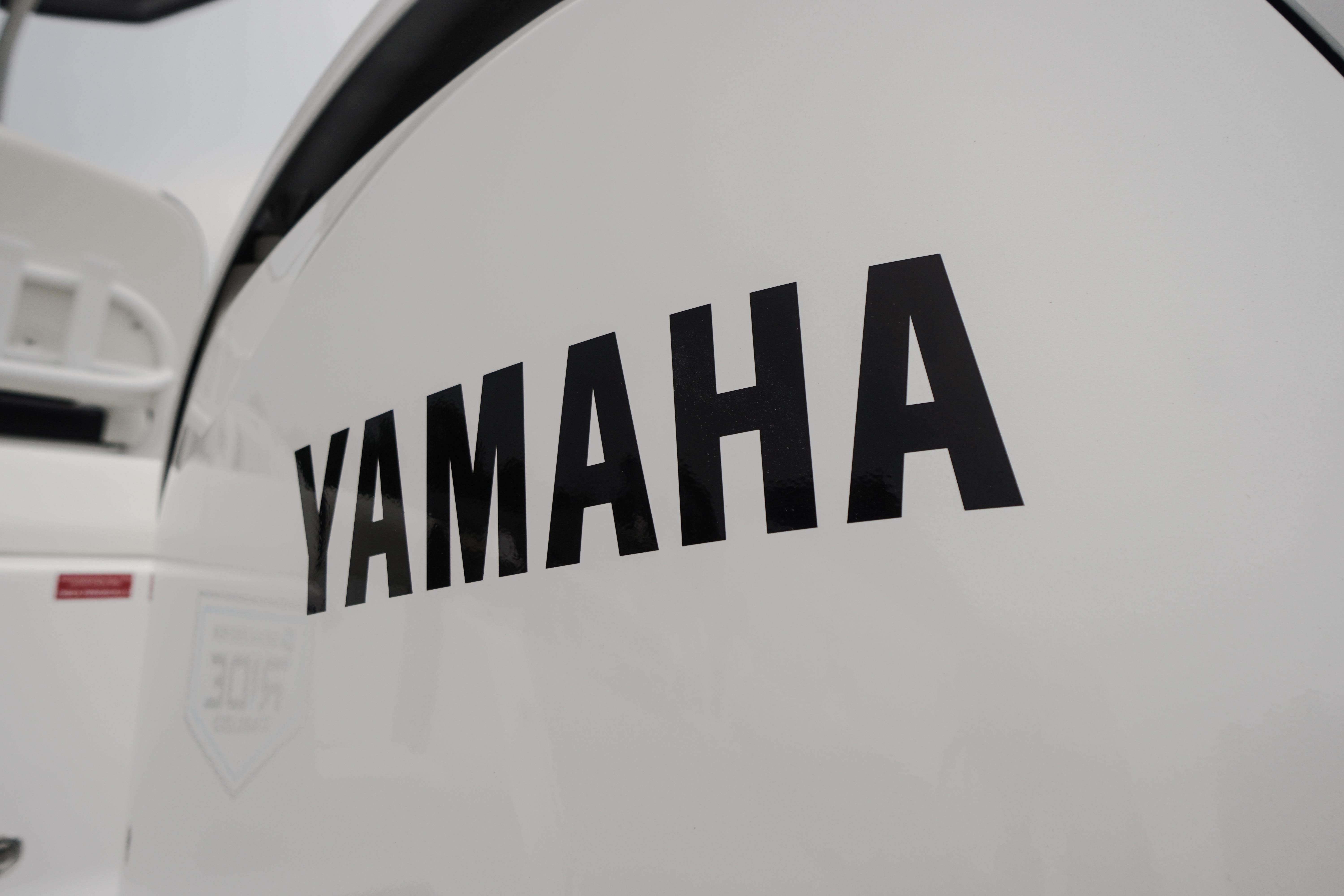 Close-up of Yamaha logo on 2026 Tidewater 232 SS boat.