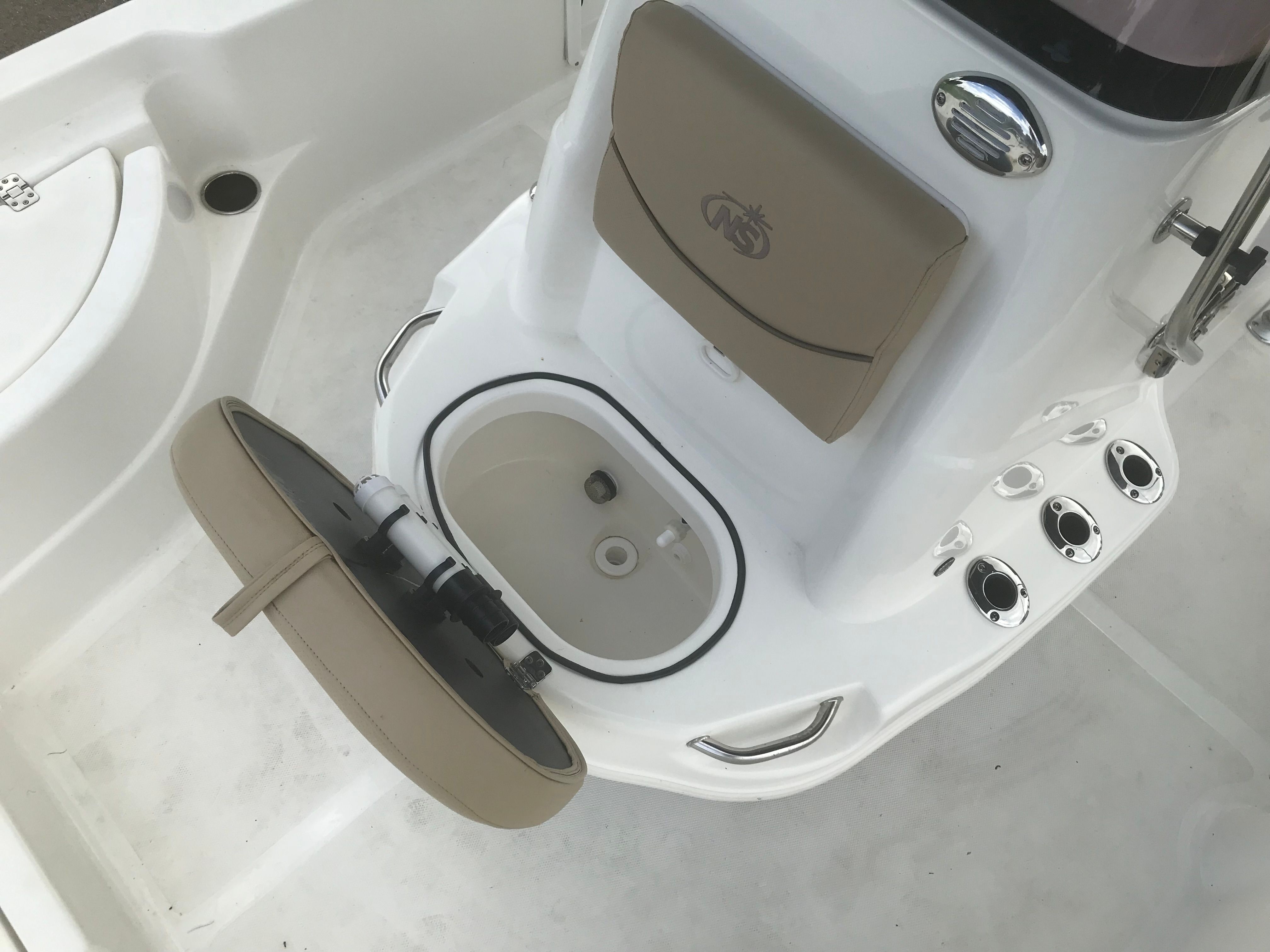 Interior view of 2020 NauticStar 215 XTS boat with seat and console.