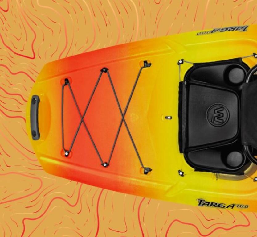 Top view of a 2023 Wilderness Systems Targa 100 kayak with vibrant orange and yellow design.