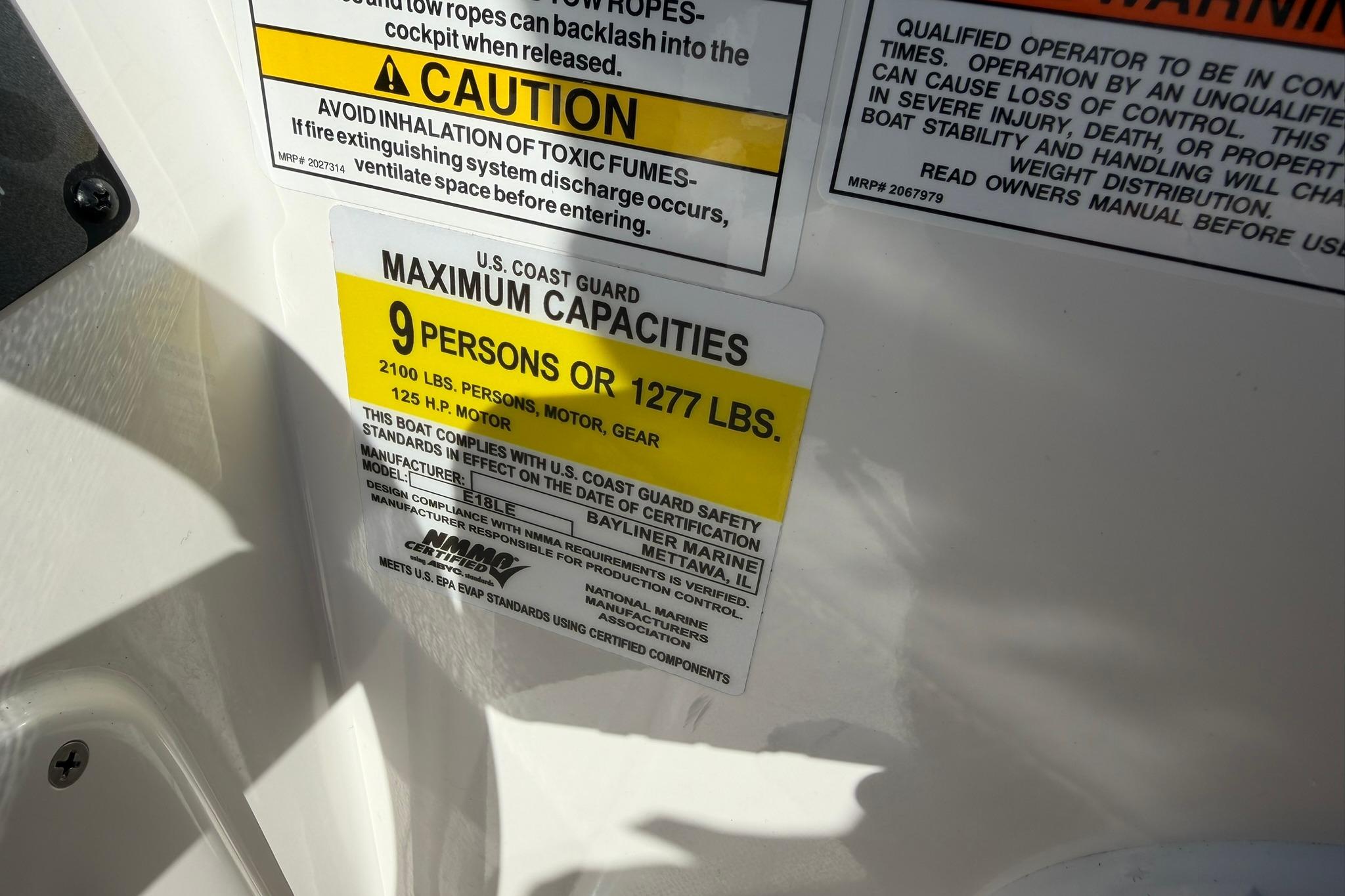 Capacity label on 2026 Bayliner Element E18, max 9 persons or 1277 lbs.