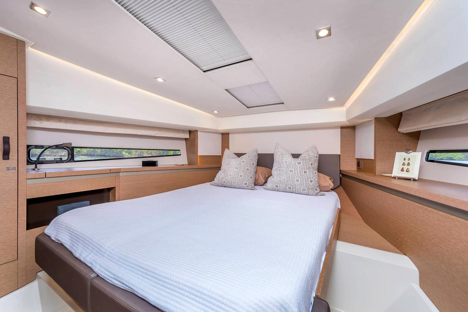 Manufacturer Provided Image: Luxurious cabin interior of 2025 Prestige 460 yacht with modern design and cozy bedding.