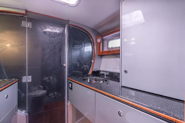 Modern bathroom interior in 2025 Shuttleworth 52 AeroRig yacht, featuring sleek design and compact layout.