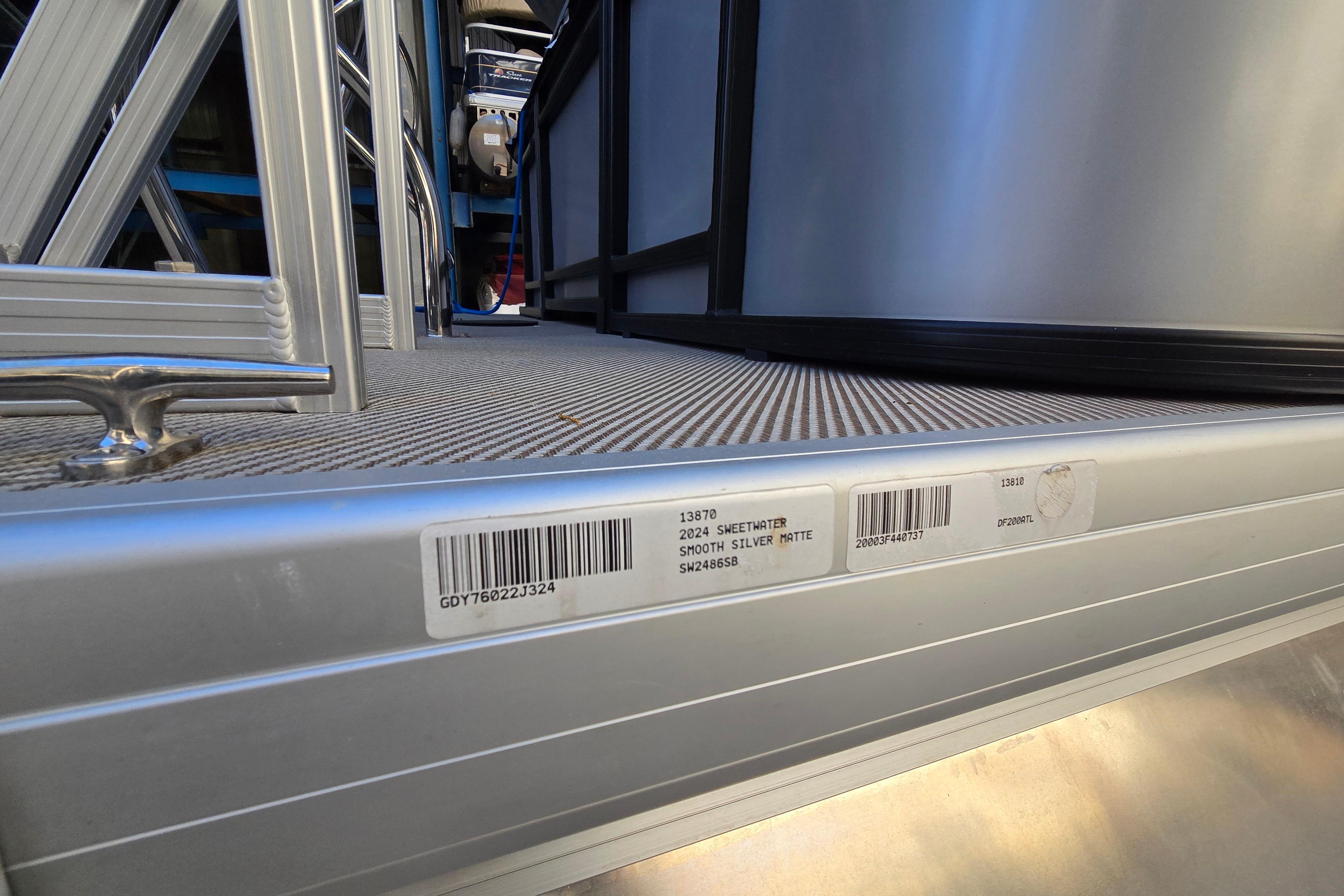 2024 Godfrey Sweetwater 2486 SB pontoon, smooth silver matte finish, barcode visible.