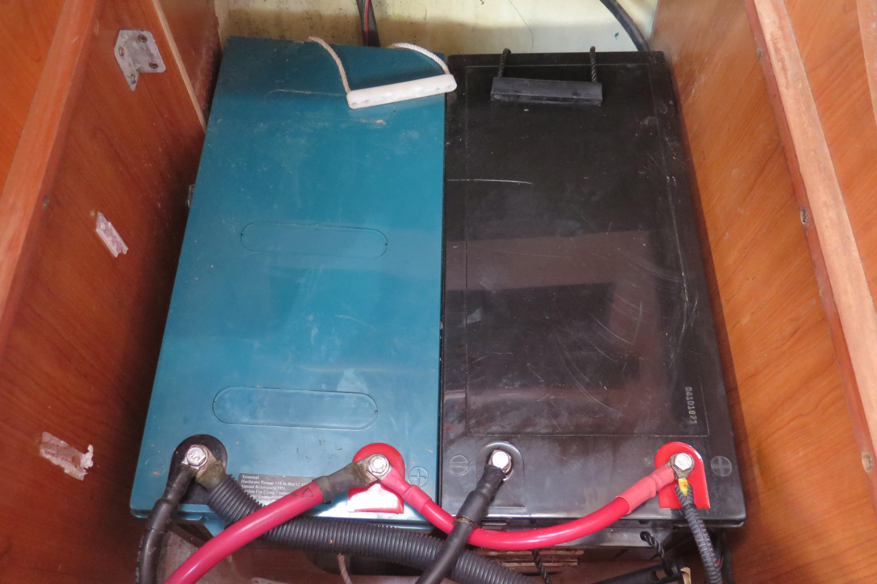 Battery compartment of a 2008 Hunter 41 Deck Salon sailboat, featuring dual batteries.