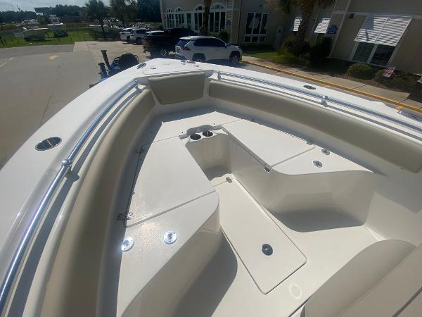 2024 Key West 239 FS boat interior with seating and storage compartments.