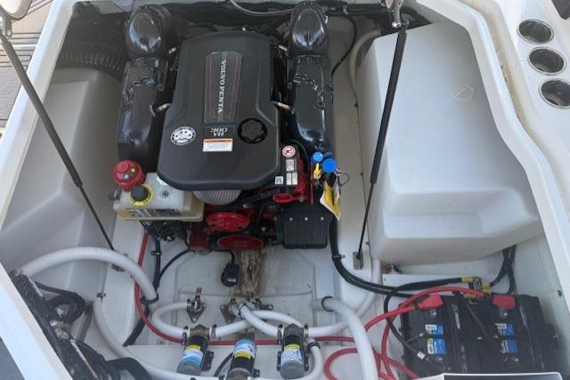2023 Cobalt R6 Surf boat engine compartment with Volvo Penta engine and battery setup.