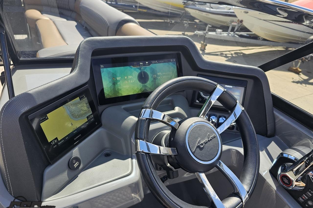 2024 Avalon Excalibur Quad Lounge dashboard with modern controls and sleek steering wheel design.