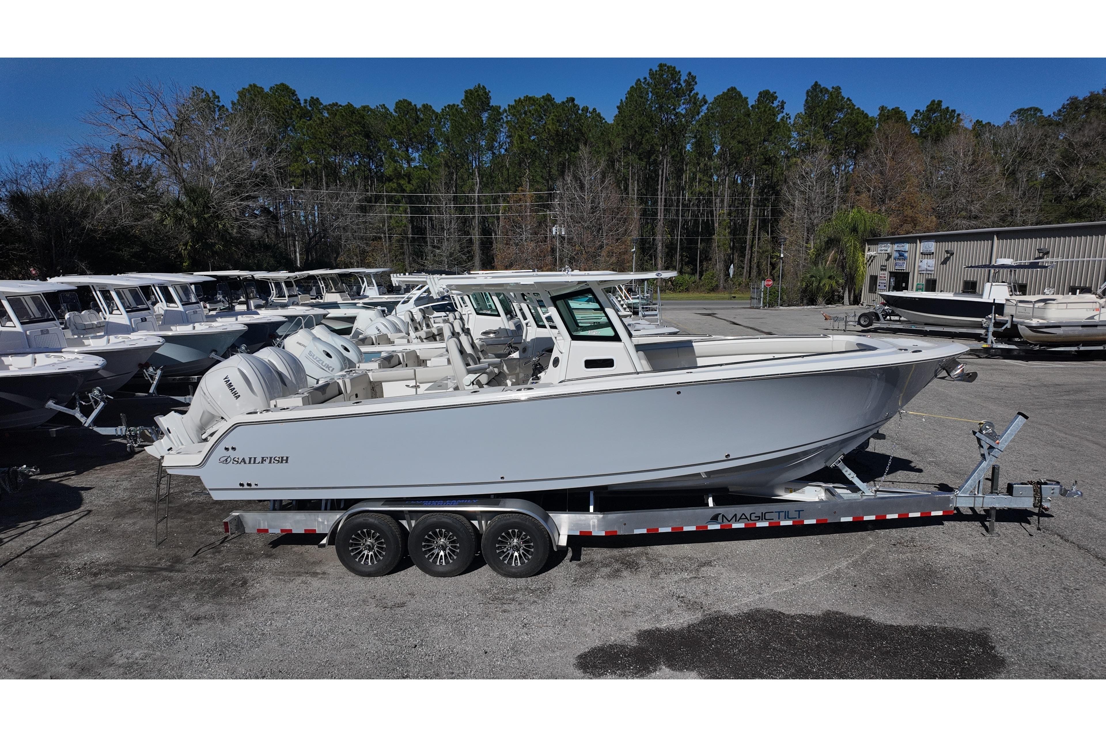 2026 Sailfish 272 CC boat on trailer, parked outdoors at dealership.