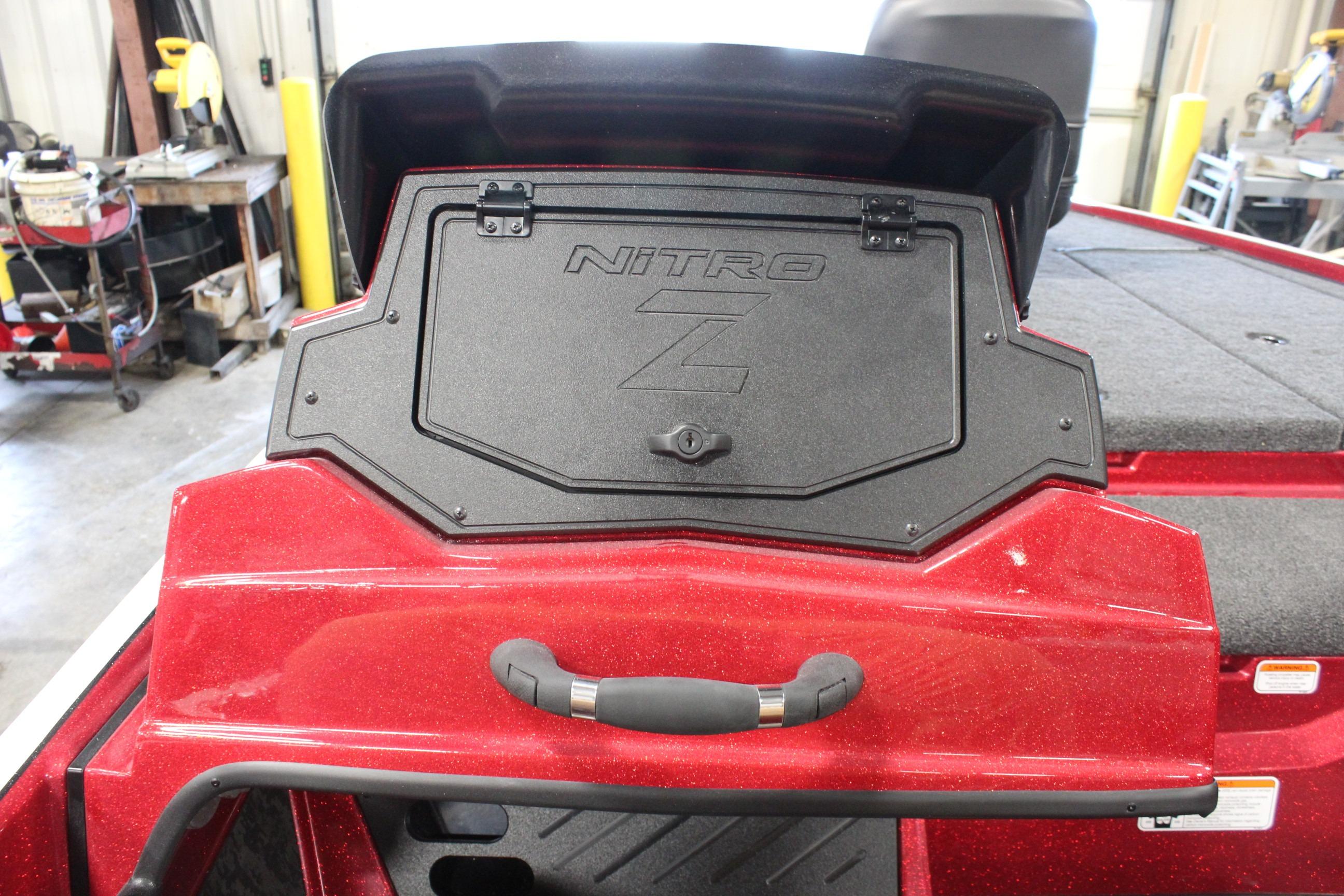 2026 Nitro Z19 XL Pro boat rear storage compartment in a workshop setting.