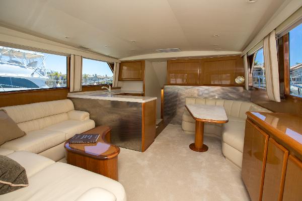 Luxurious interior of a 2000 Viking 50 Convertible Sport Fisher yacht with elegant seating and dining area.