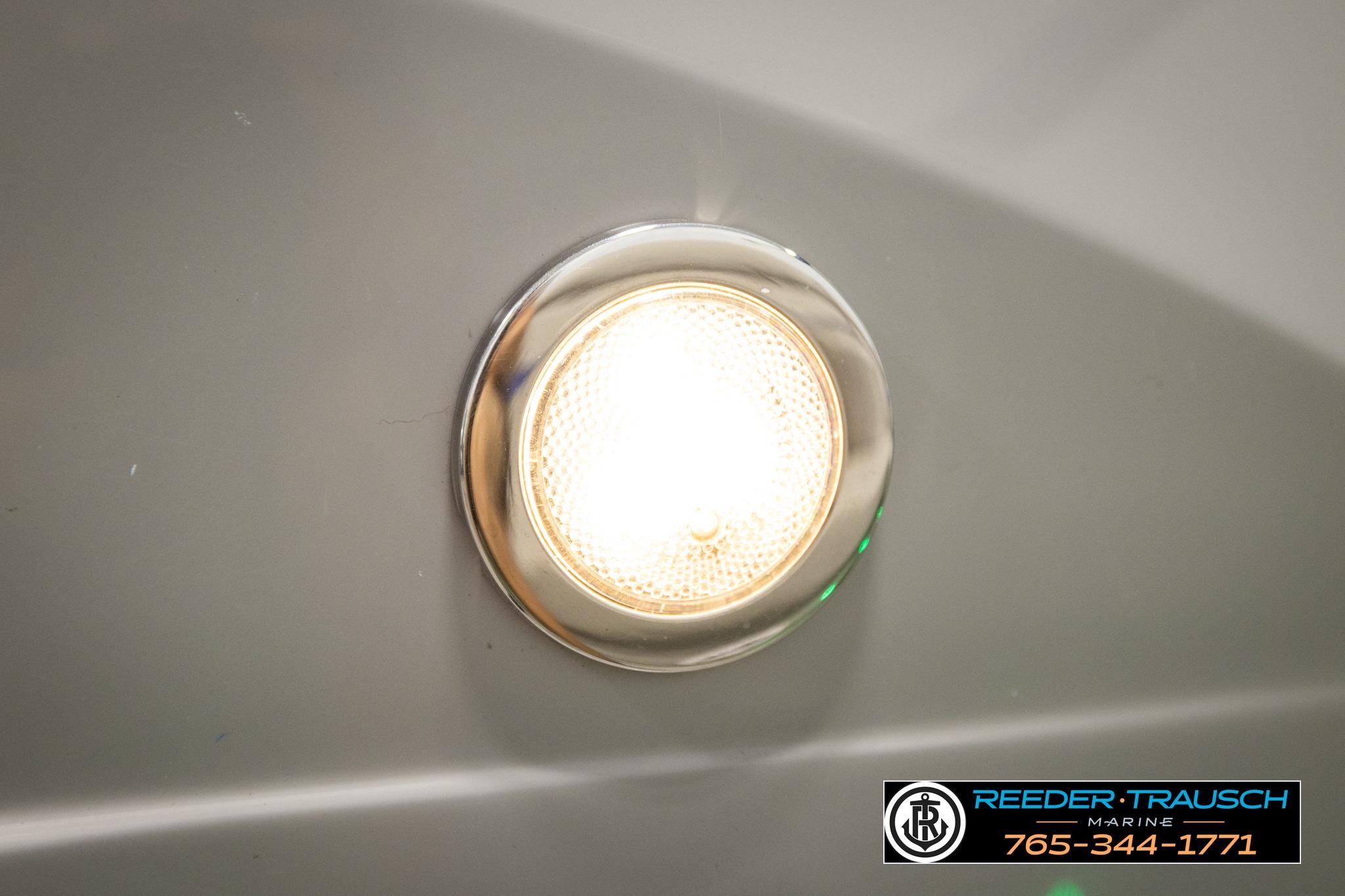 Close-up of a 2021 Bennington 20 SV boat light with Reeder-Trausch Marine logo.