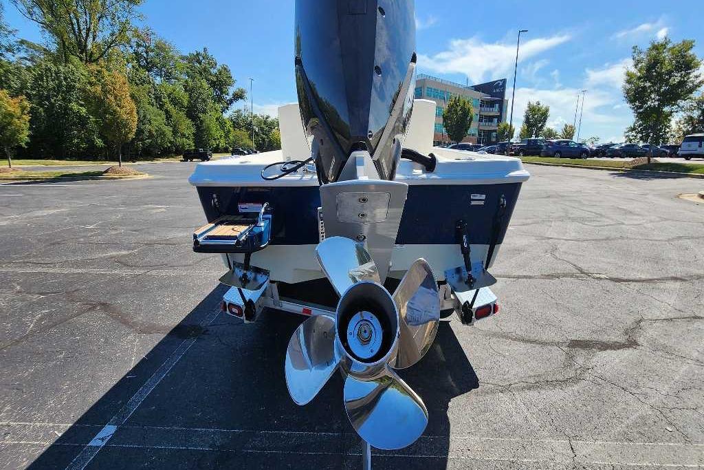 2025 Ranger 2510 Bay boat rear view with propeller in parking lot.