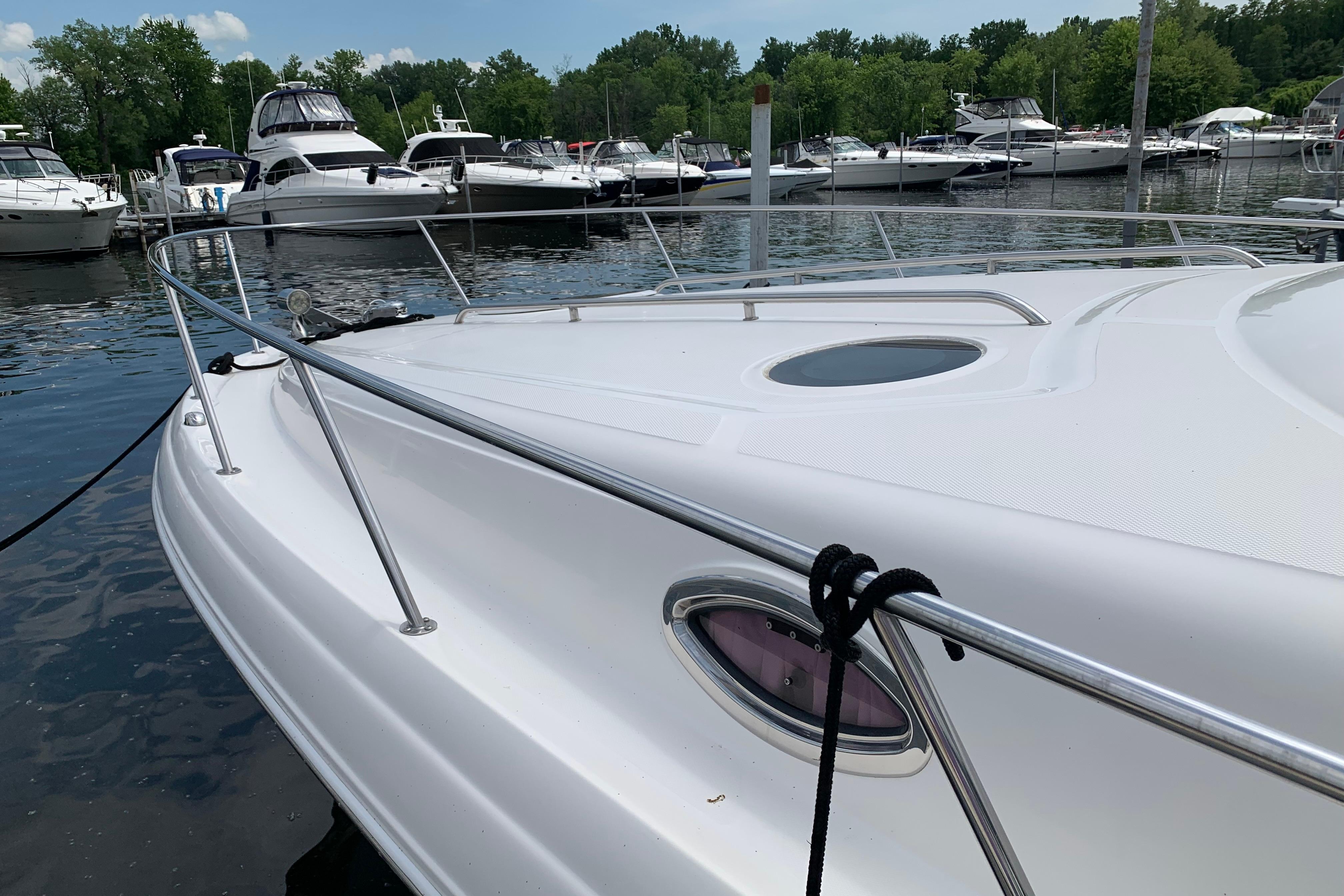 2007 Sea Ray 340 Sundancer docked at a marina with other boats.