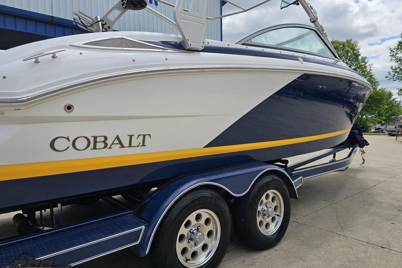 2010 Cobalt 232 WSS boat on trailer, featuring sleek design and vibrant colors.