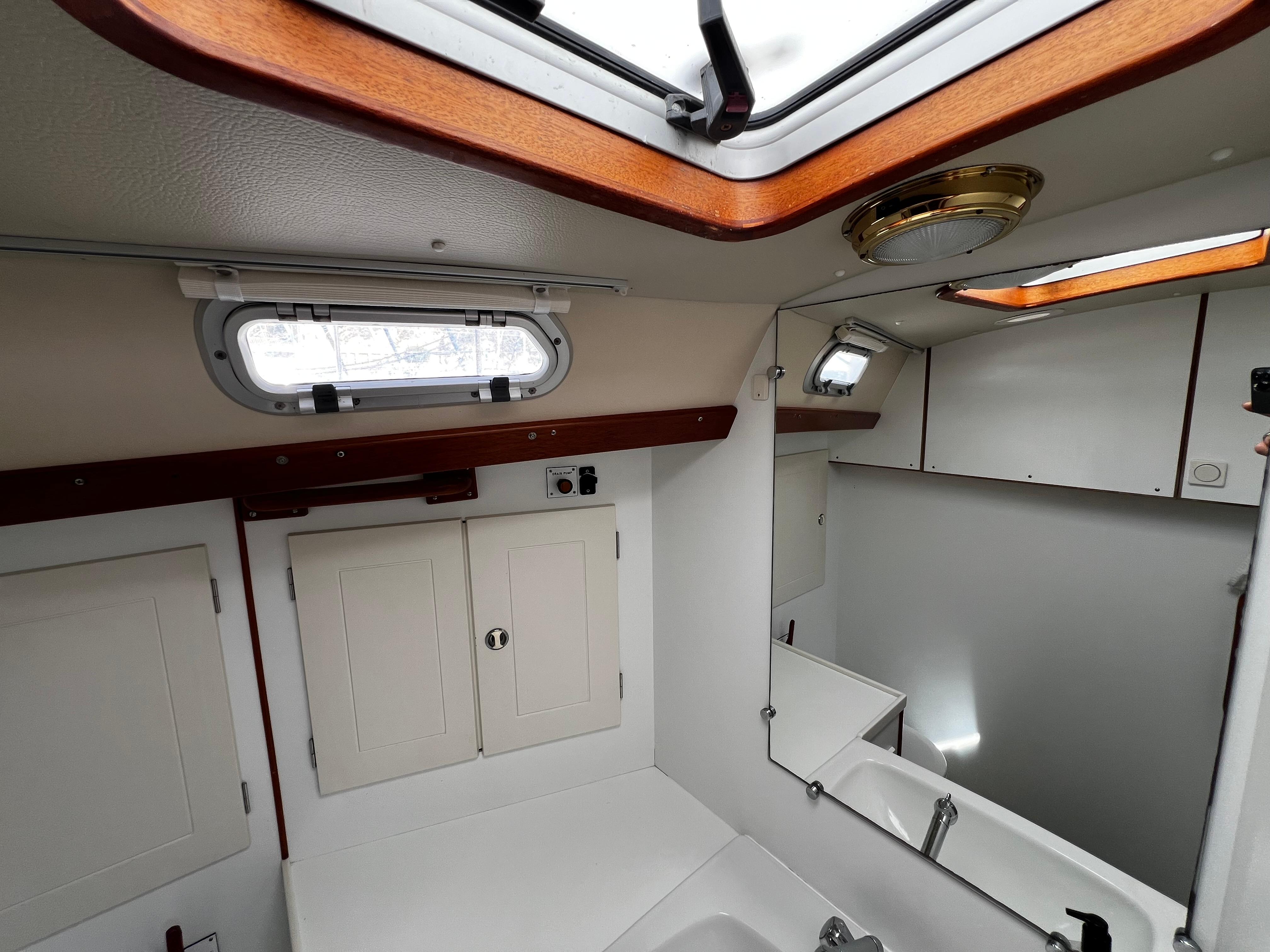 Interior of 2001 Hallberg-Rassy 42 sailboat, featuring a compact, well-lit bathroom.