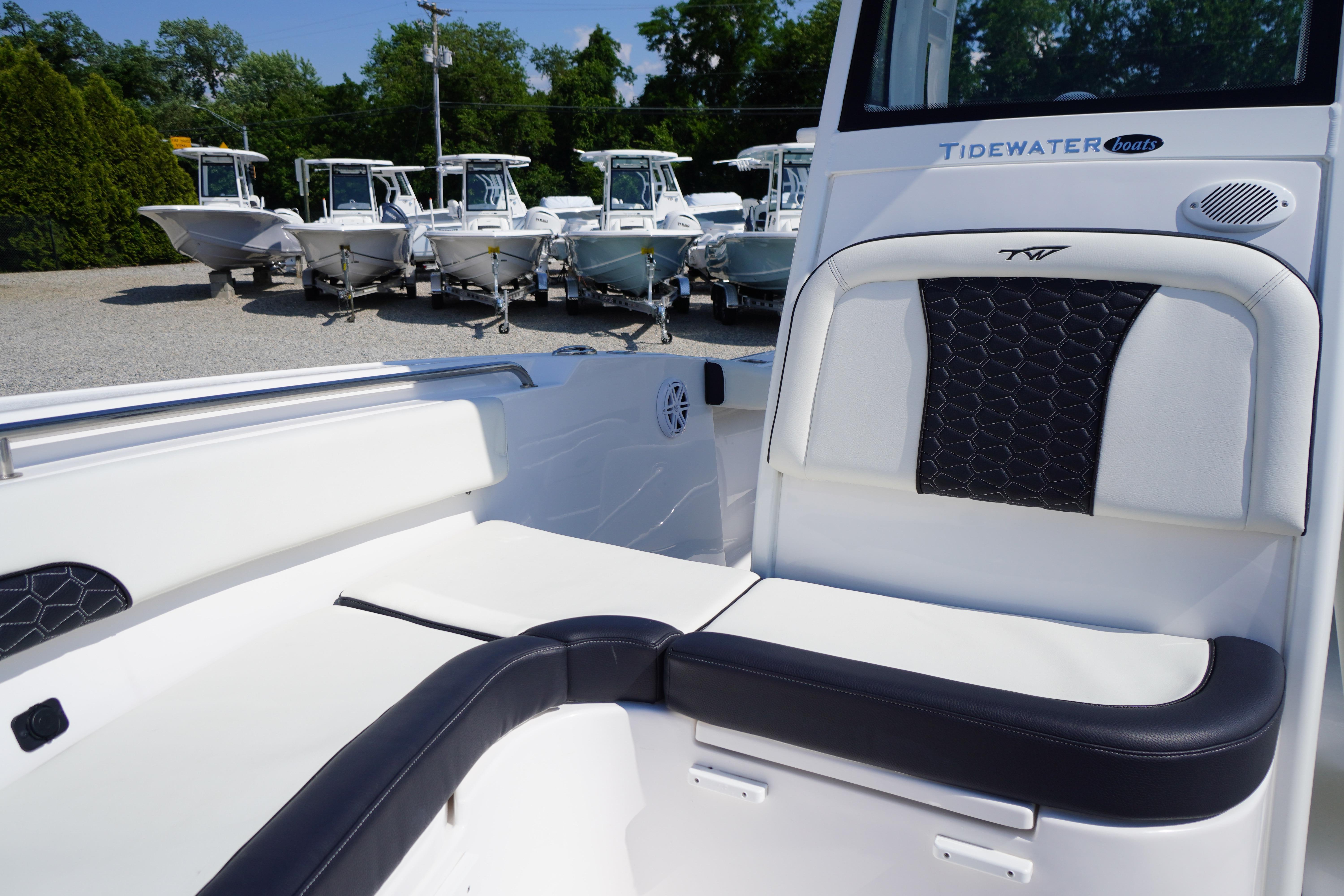 2025 Tidewater 232 SS boat interior with cushioned seating and sleek design.