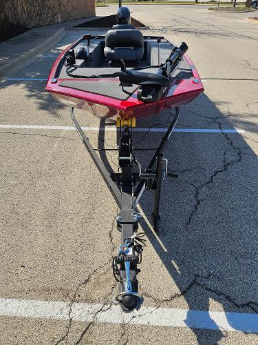 2025 Tracker Panfish 17 boat on trailer, parked in a lot, front view.