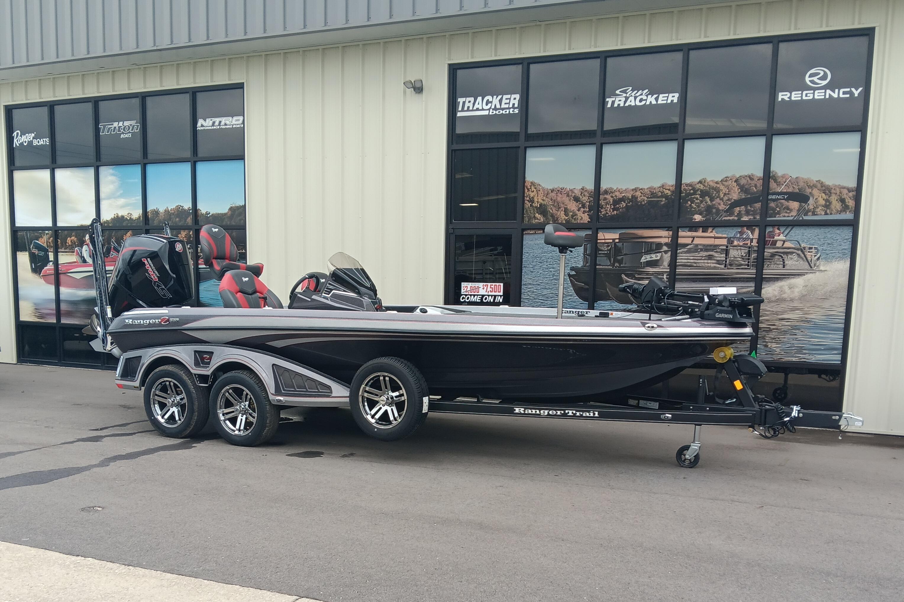 2026 Ranger Z520 boat parked outside dealership with promotional signage.