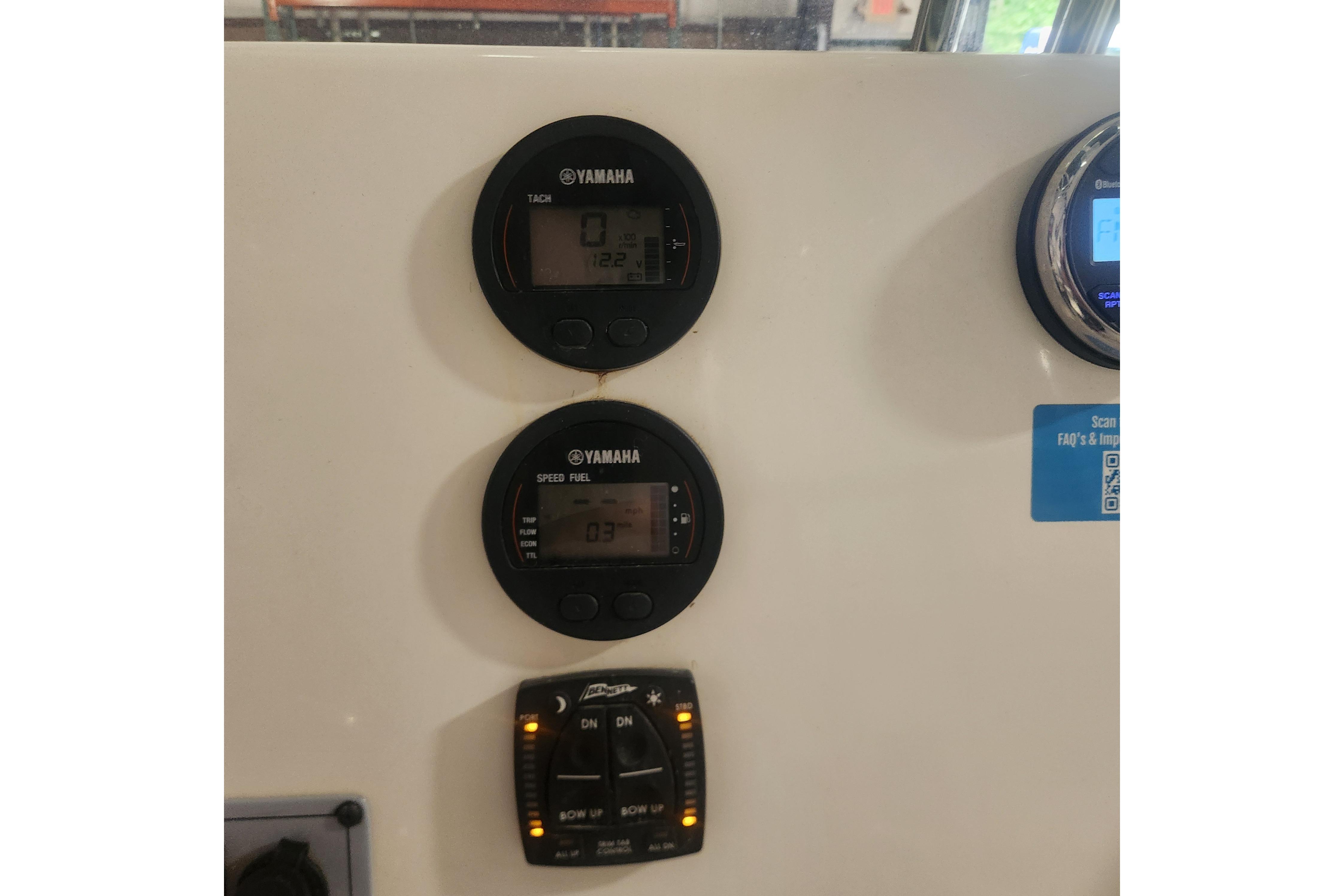 Dashboard of 2023 Key West 219 FS boat with Yamaha gauges and controls.