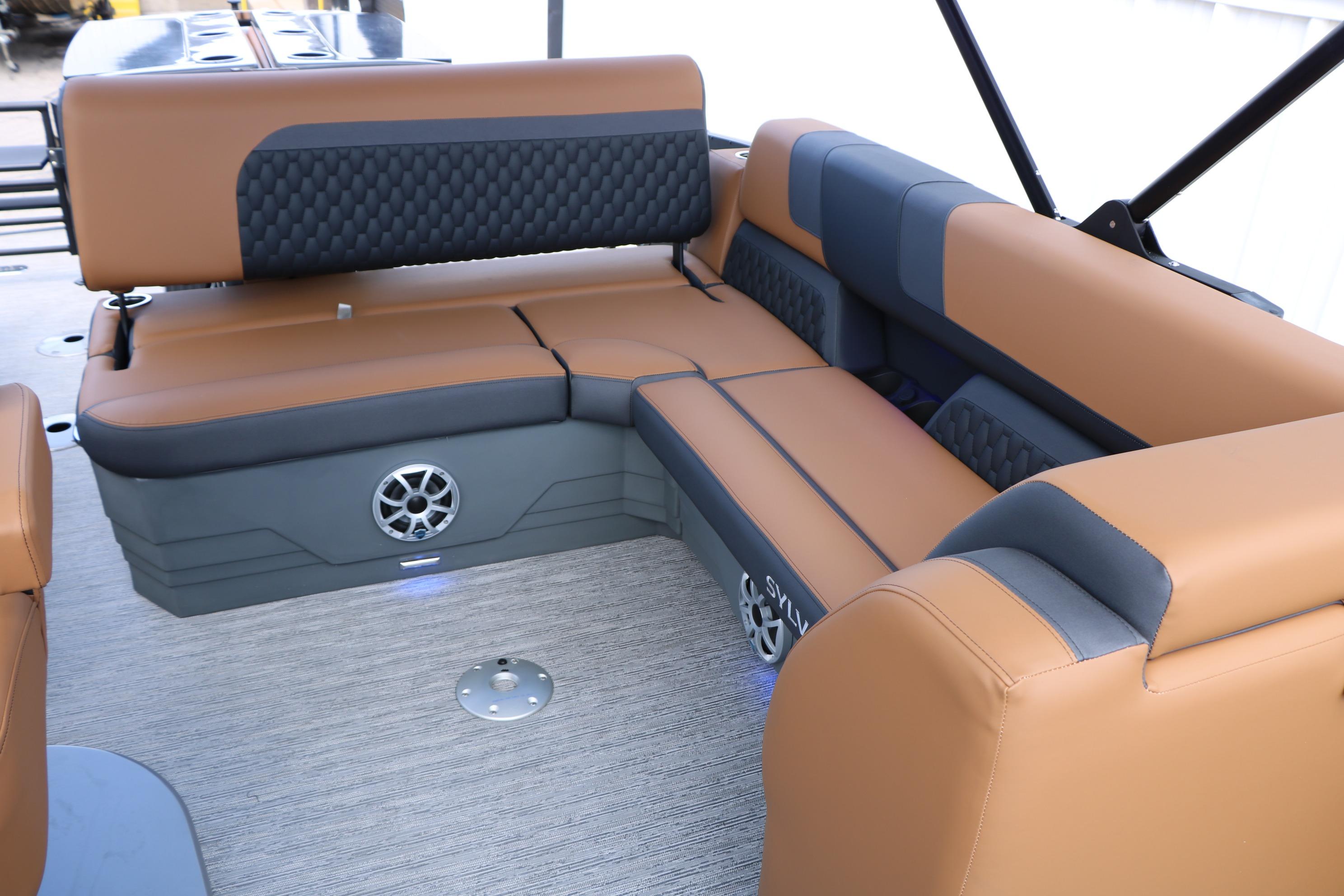 Luxurious seating on 2026 Sylvan L3 DLZ Bar Platinum Edition Tri-Toon boat interior.
