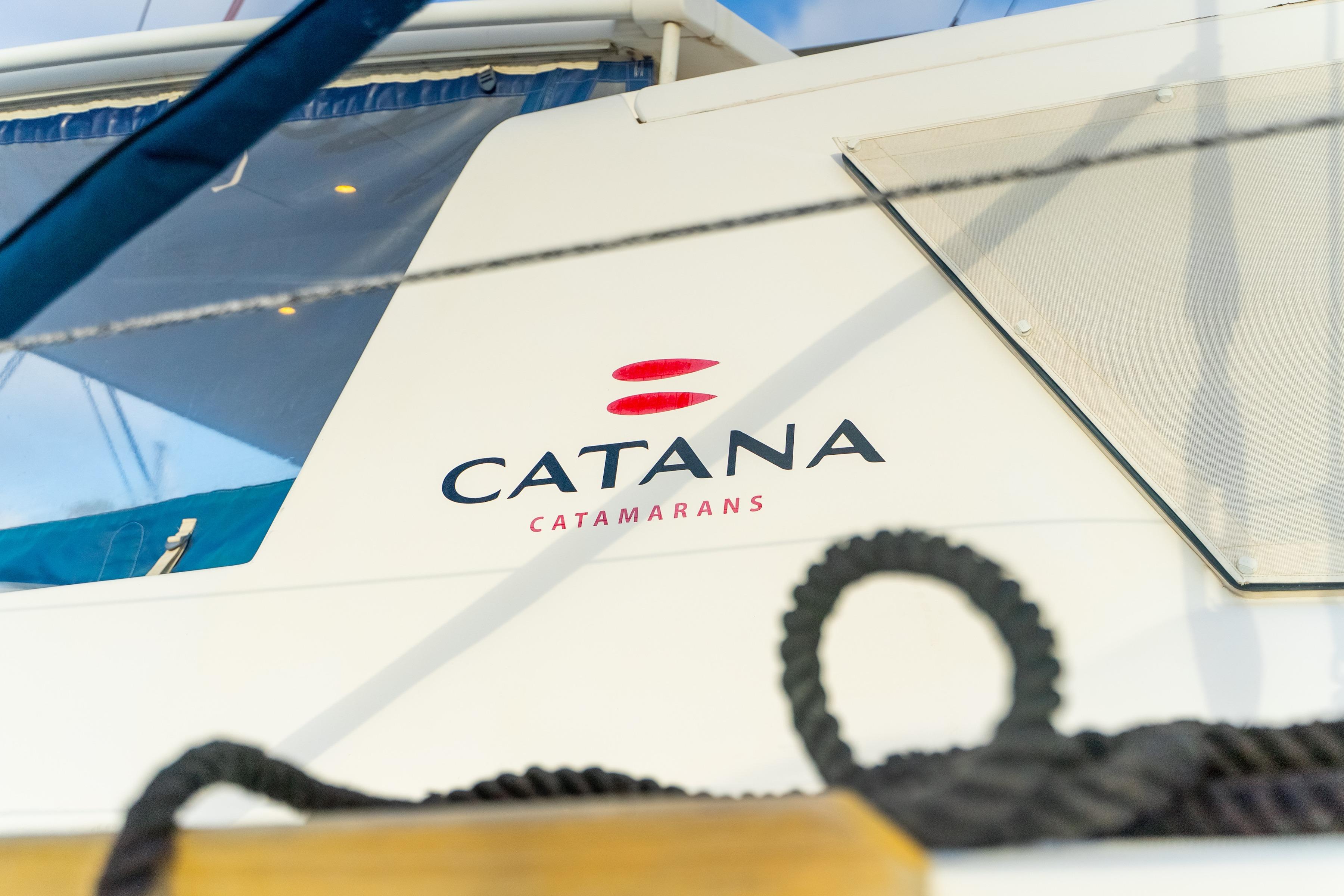 Catana 65 catamaran, 2009 model, featuring logo and sleek design elements.
