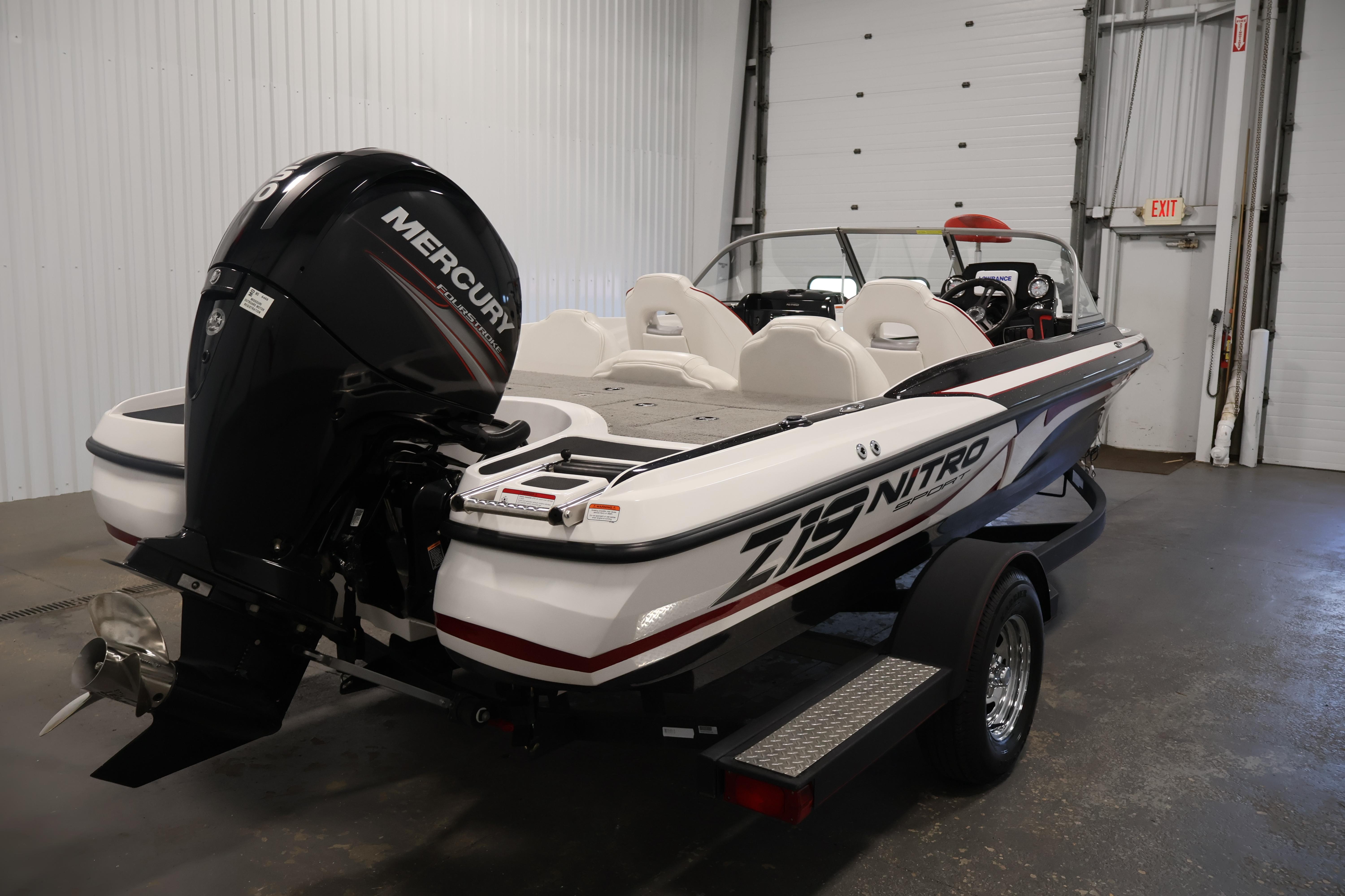 2019 Nitro Z19 Sport boat with Mercury engine in a garage setting.