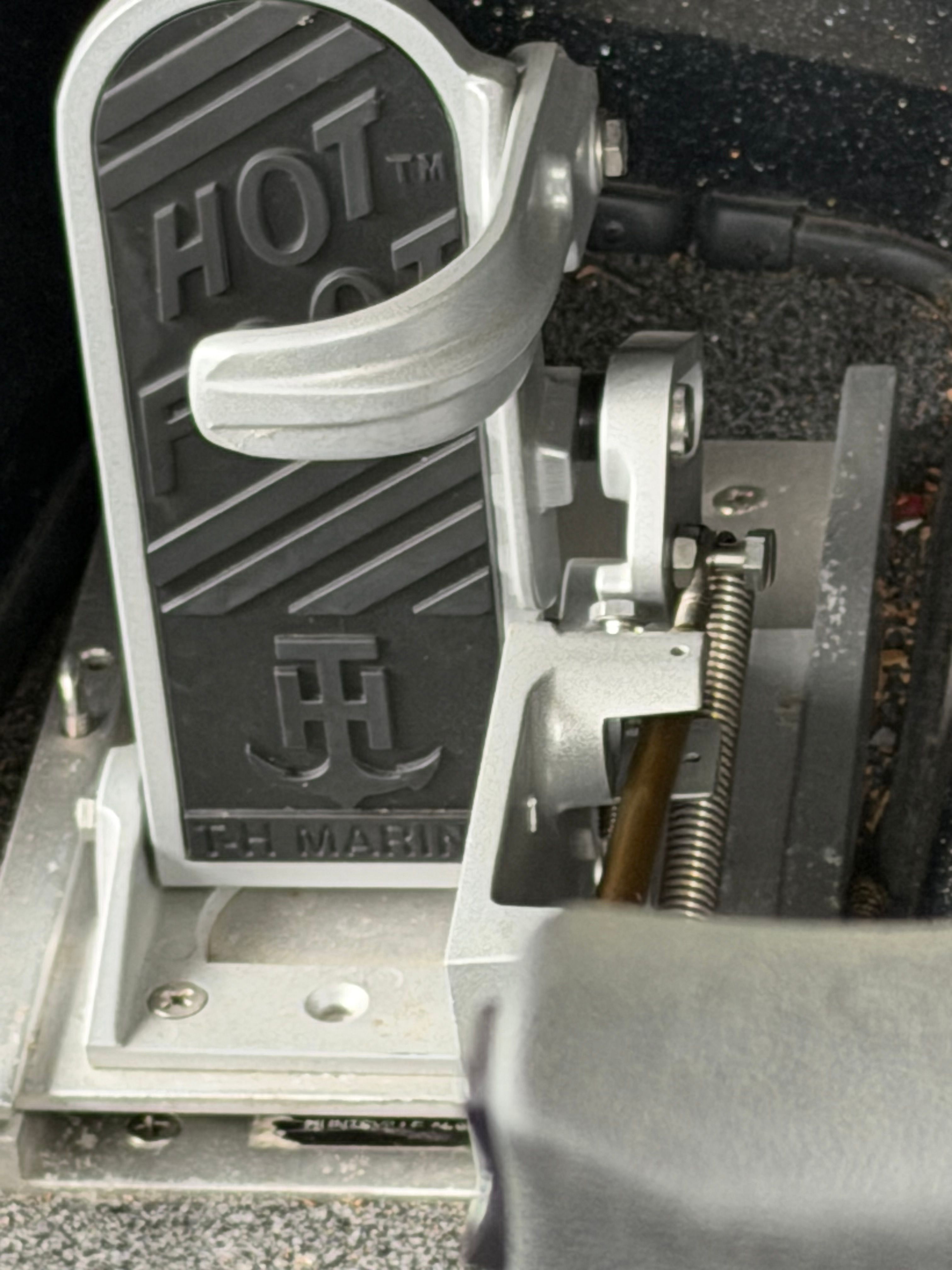 Close-up of a boat pedal labeled "Hot Foot."