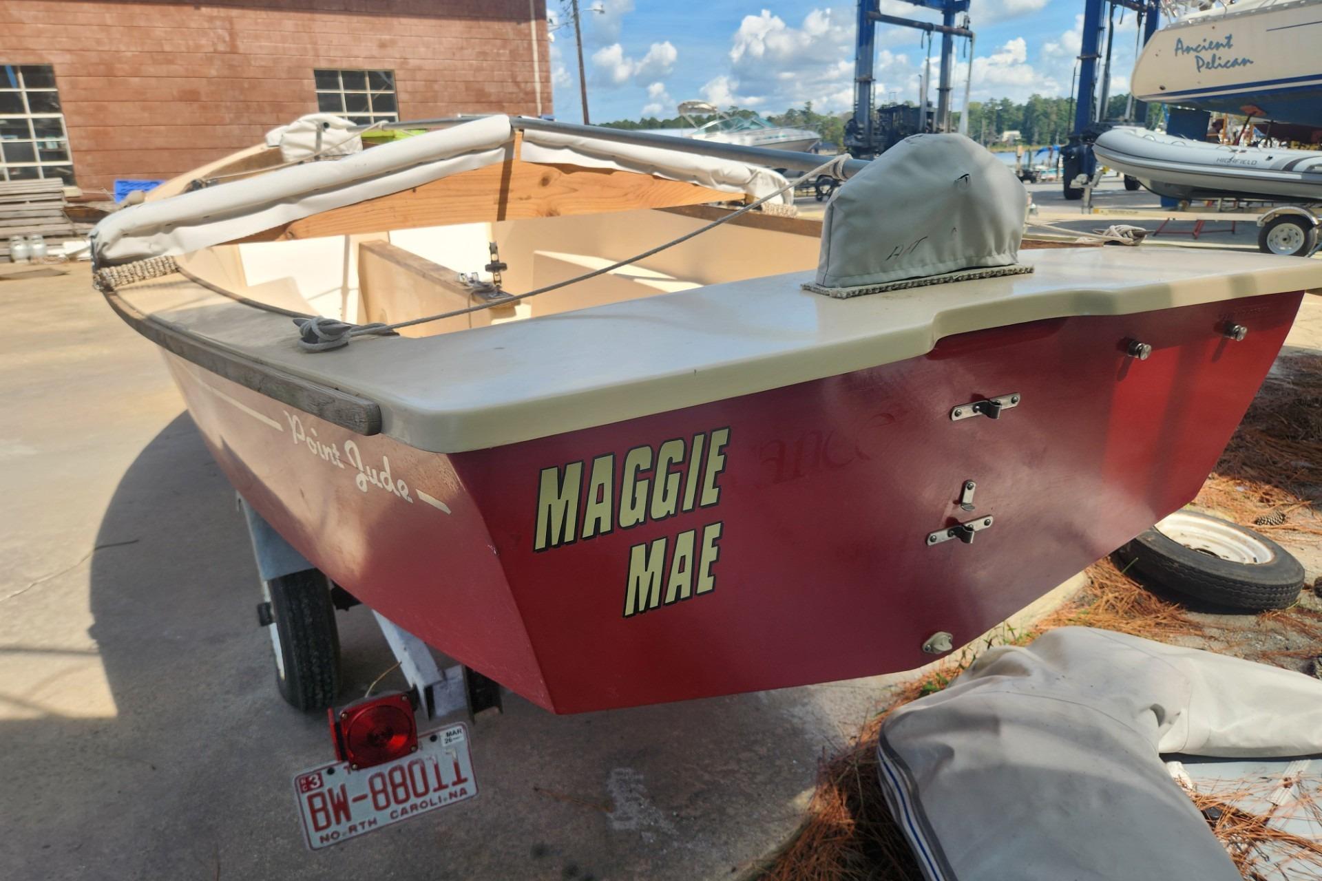 Red Point Jude 16 sailboat from 1986 named "Maggie Mae" on a trailer.